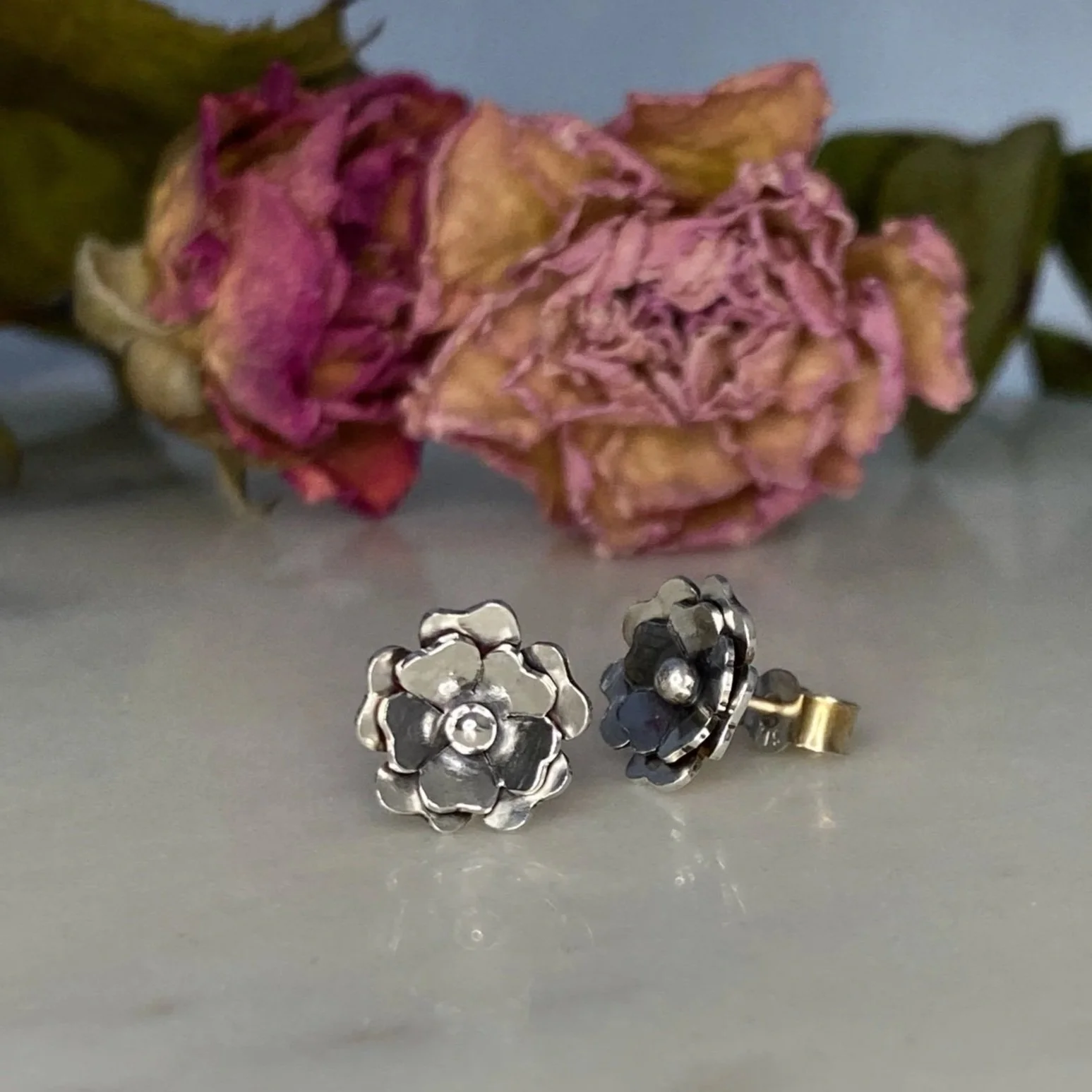 Handmade, sterling silver, flower, stud earrings. Handcrafted by Walter and Nancy Jewellery.