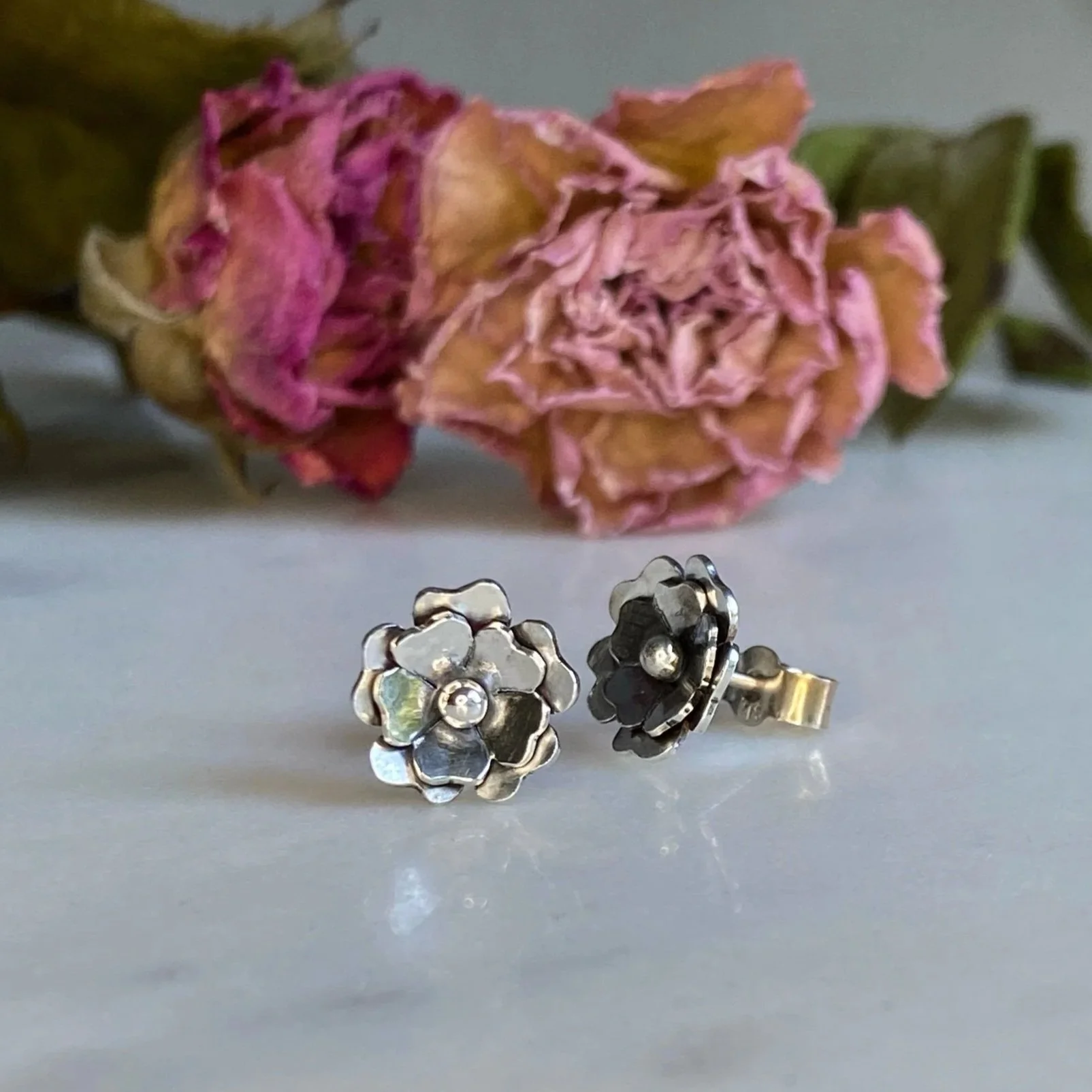 Handmade, sterling silver, flower, stud earrings. Handcrafted by Walter and Nancy Jewellery.