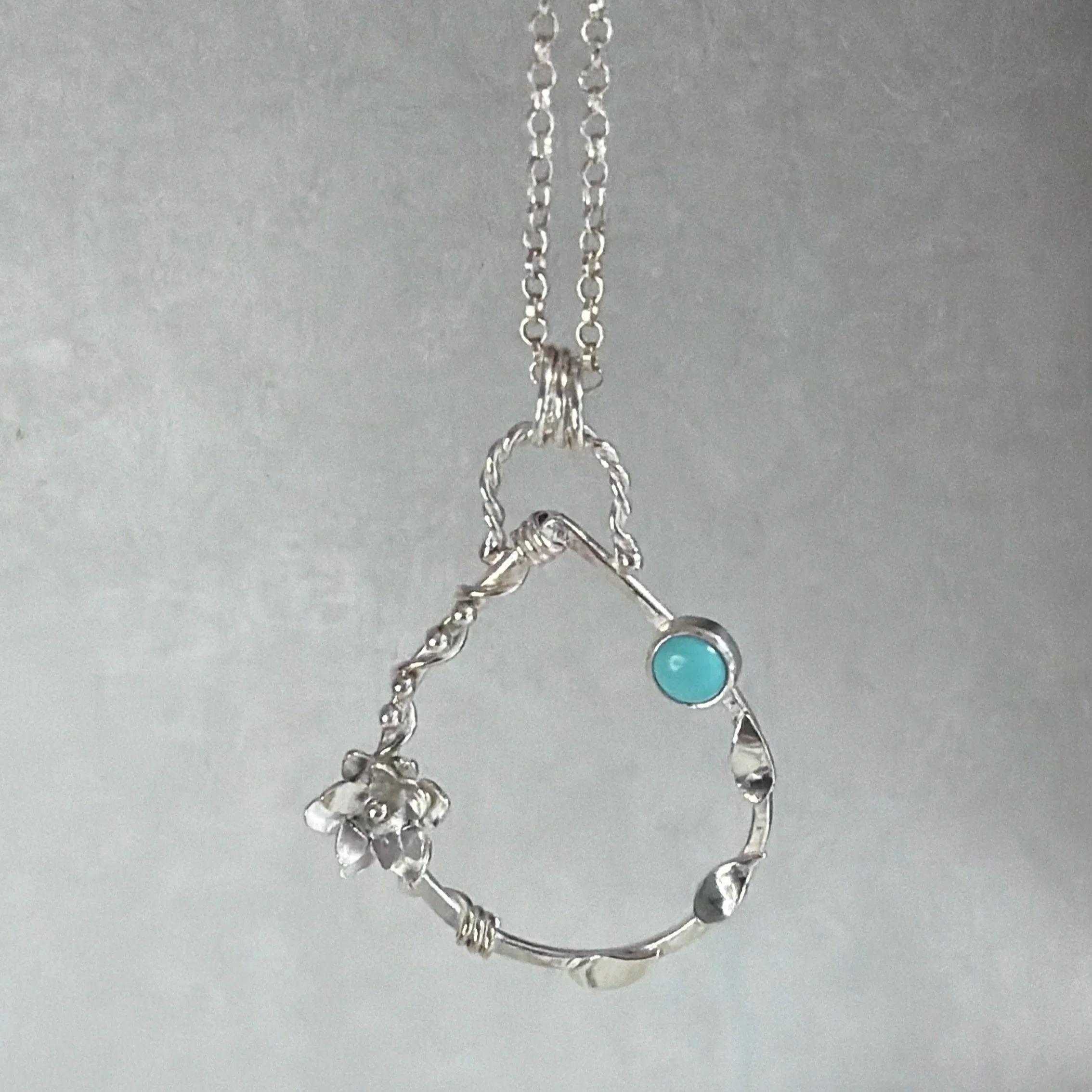 Handcrafted, botanical, sterling silver and turquoise pendant. Handmade by Walter and Nancy Jewellery.IMG_6261.jpg
