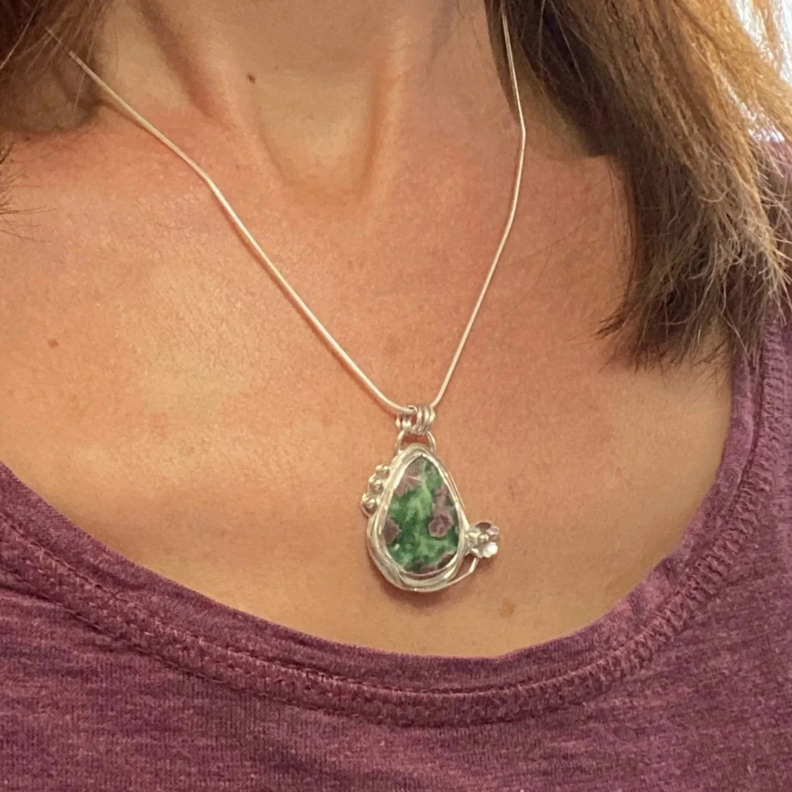 A beautiful Ruby Fuchsite stone set in a handcrafted sterling silver setting. The setting has been hallmarked in London. The piece has been designed and made by Rosie at Walter and Nancy Jewellery.