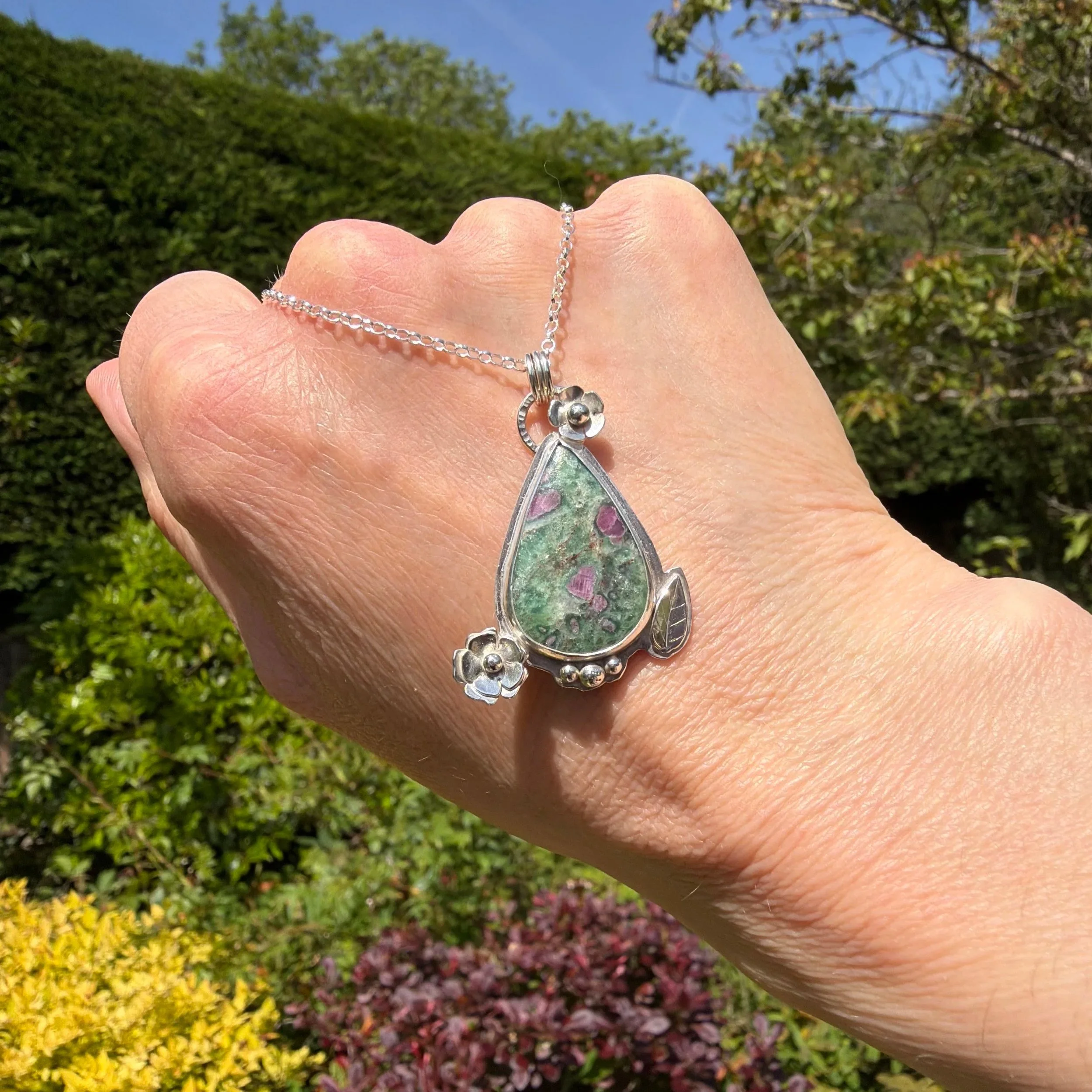 A beautiful Ruby Fuchsite stone set in a handcrafted sterling silver setting. The setting has been hallmarked in London. The piece has been designed and made by Rosie at Walter and Nancy Jewellery.