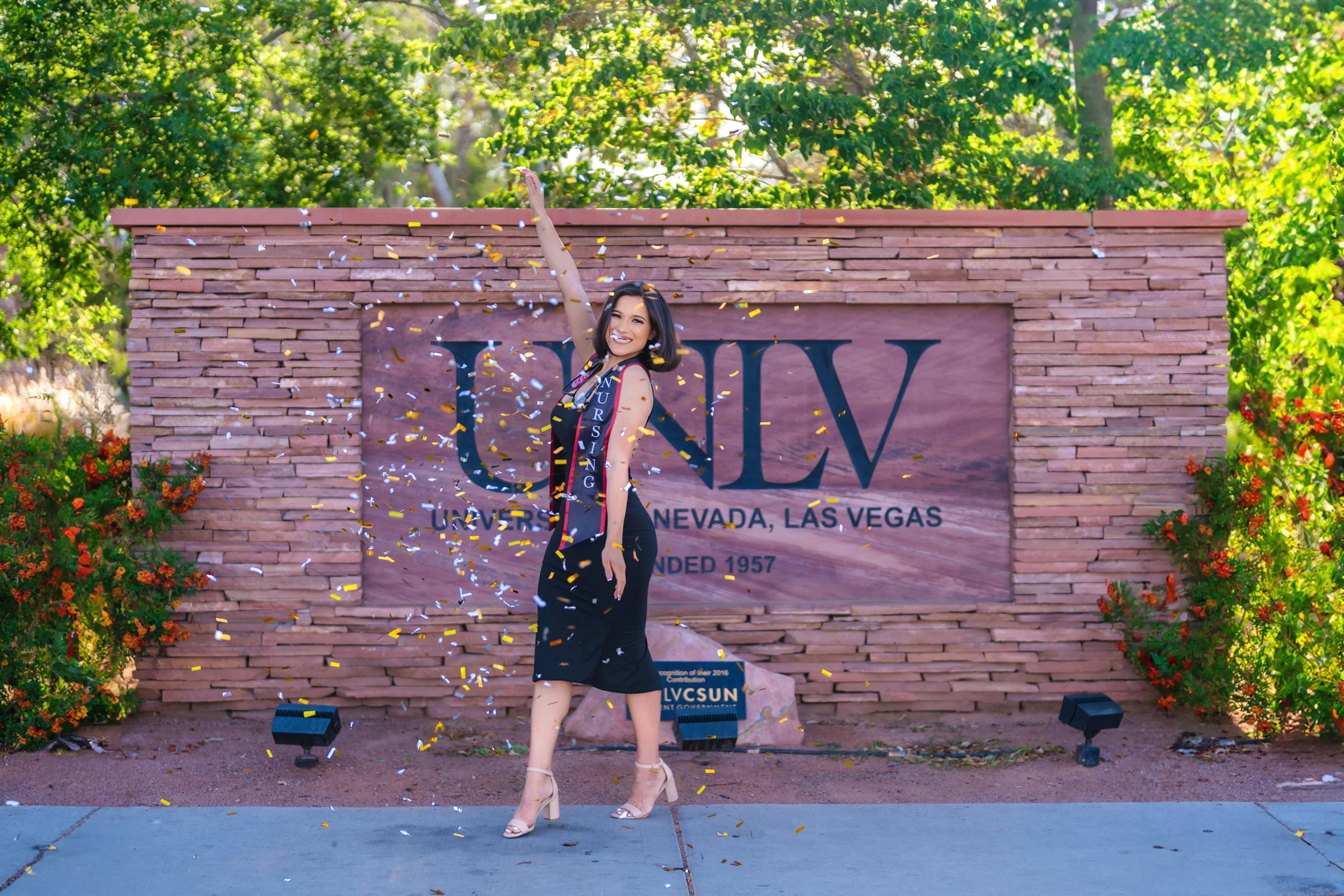 UNLV graduation portrait, confetti celebration, Las Vegas