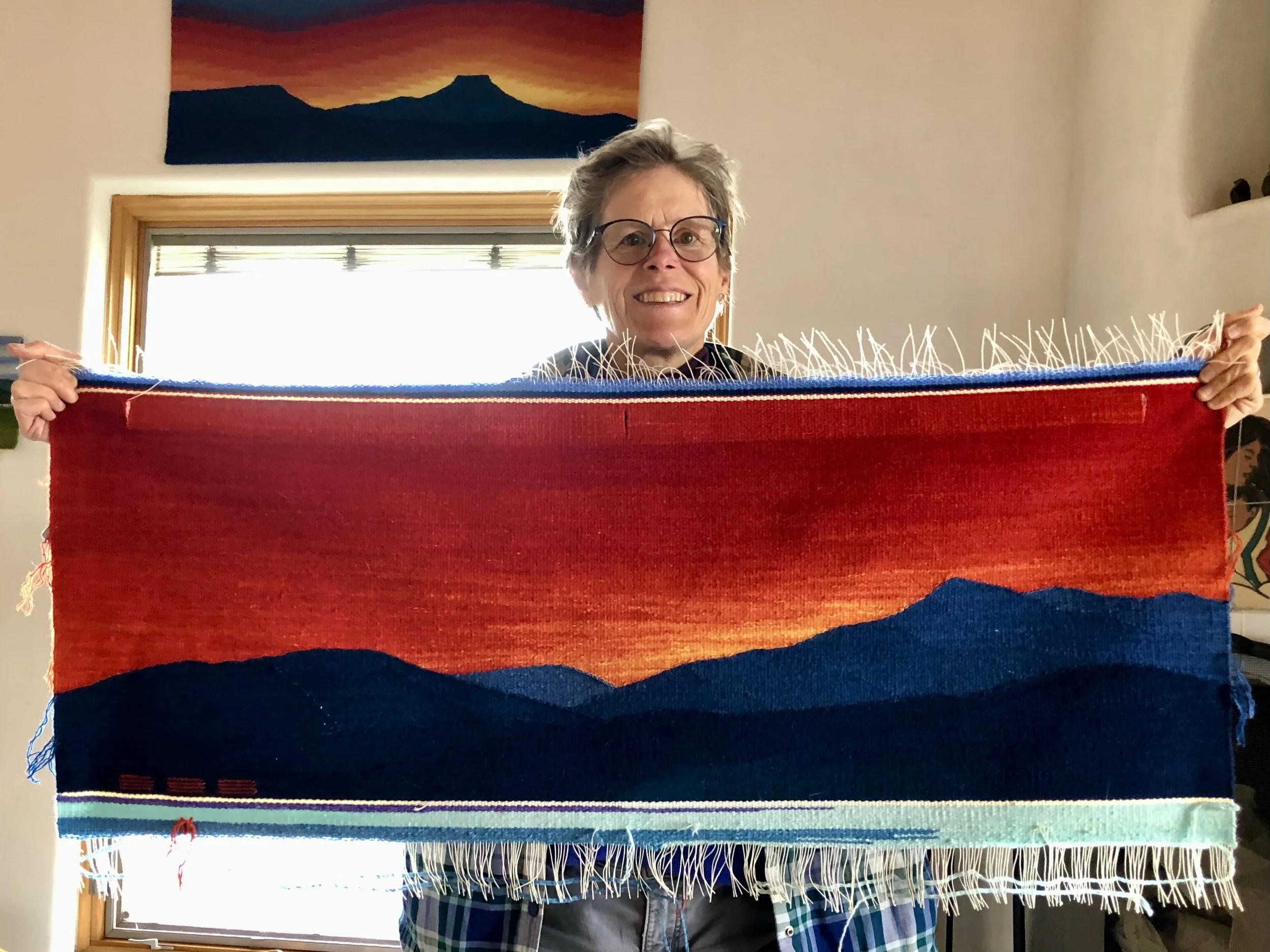 Sarah Warren with a weaving.jpeg