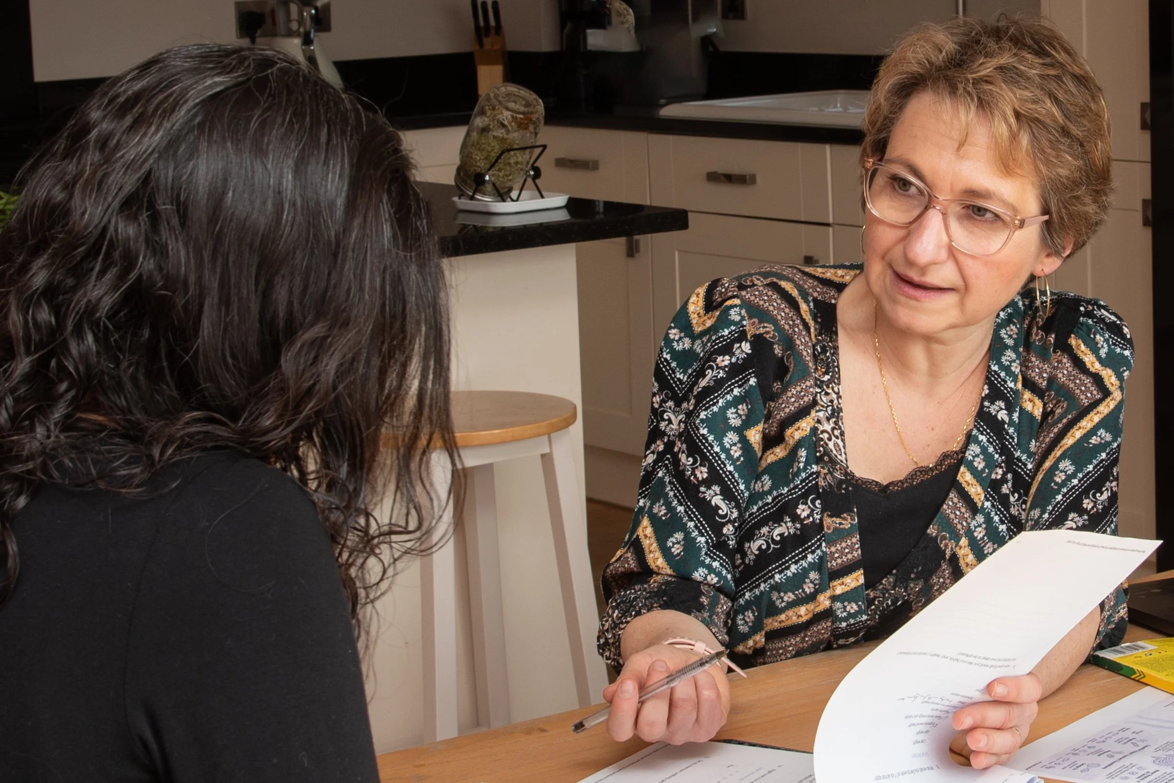 Sandra Dumas health coach talking with a female client, talking about their lifestyle and nervous system resilience