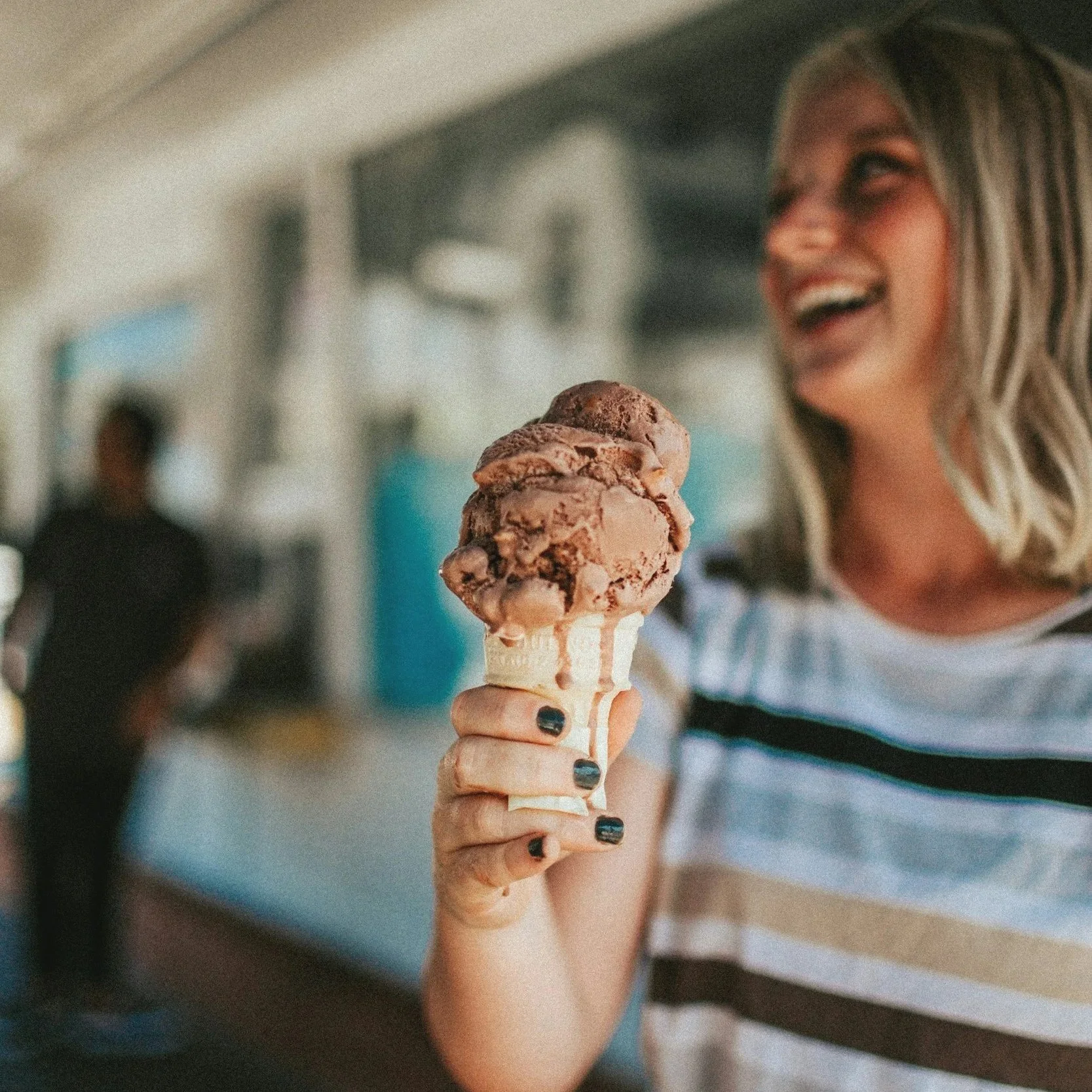 Woman eating ice cream at a family-friendly event in Ohio
