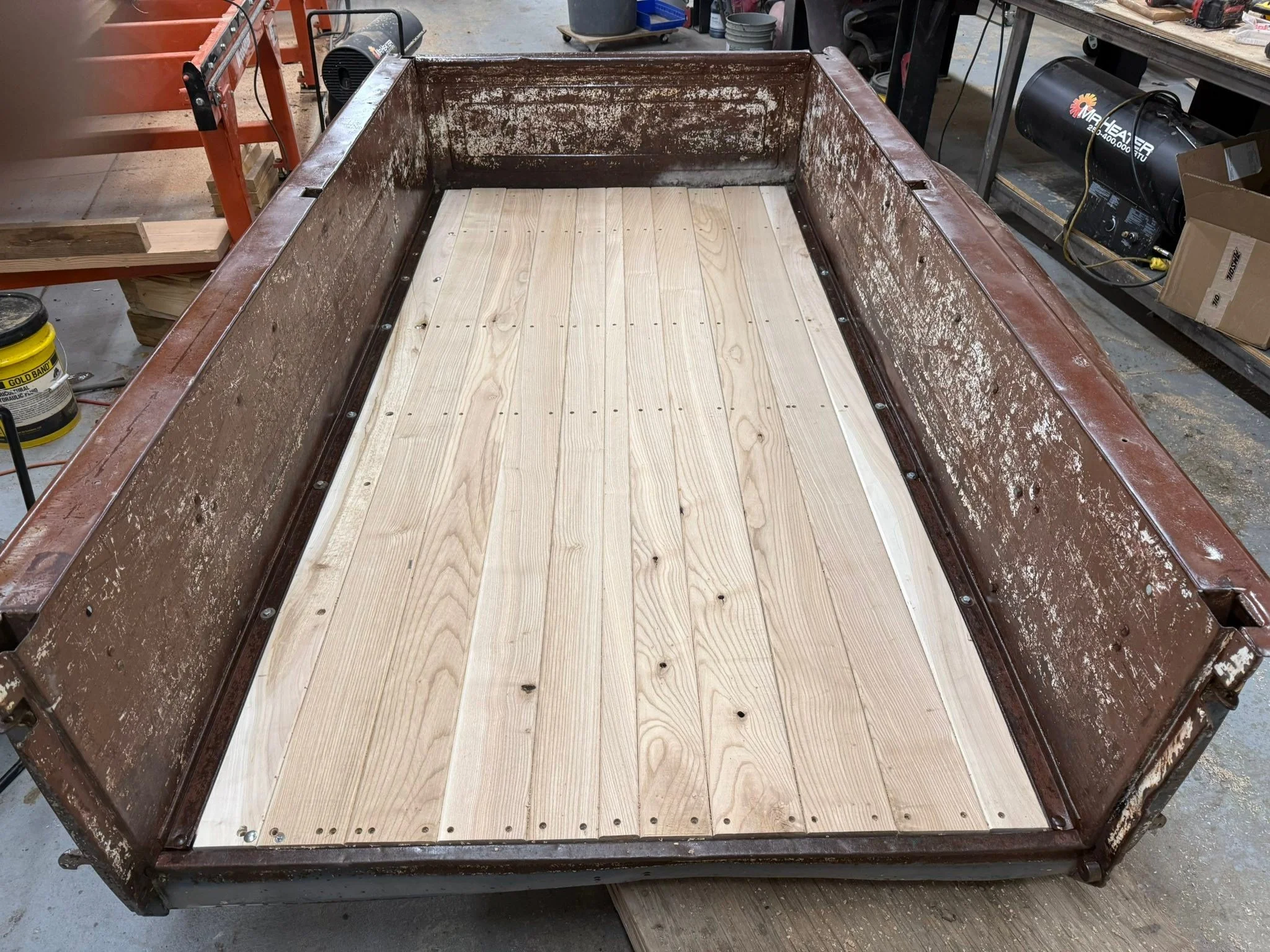 The truck bed flooring is almost done. It&rsquo;s made out of solid ash logs that I milled here on site.