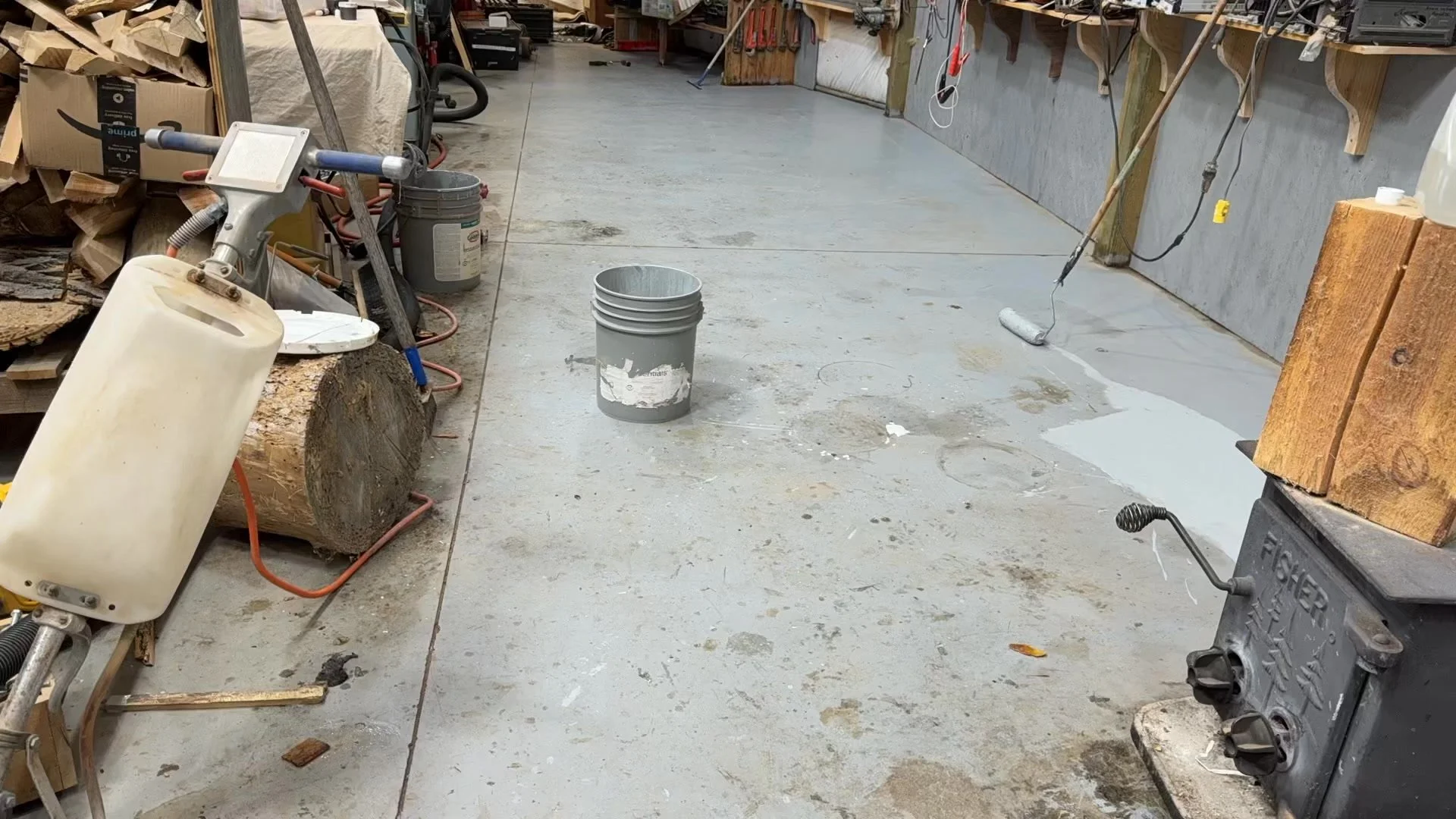 Time to tidy the shop floor up a bit. Then Buddy walked through the wet paint.