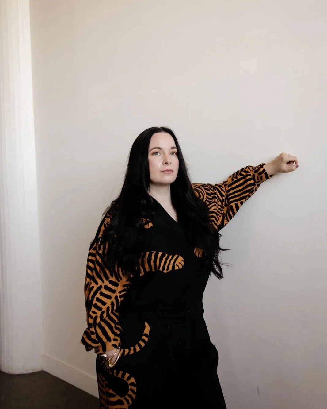 Sara Moon in still presence, grounded, reflective, minimal aesthetic