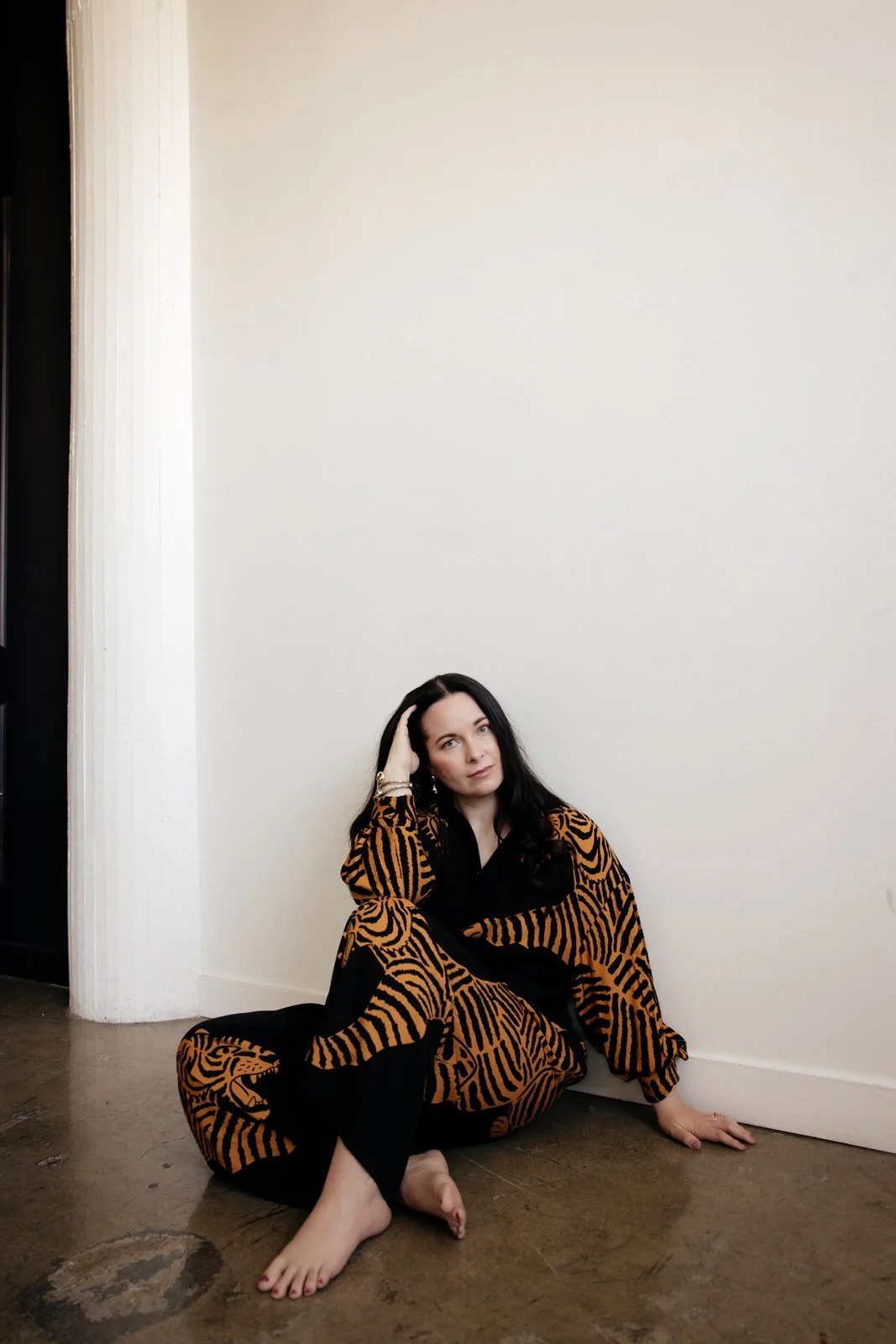 Sara Moon in still presence, grounded, reflective, minimal aesthetic Farm Rio tigers.