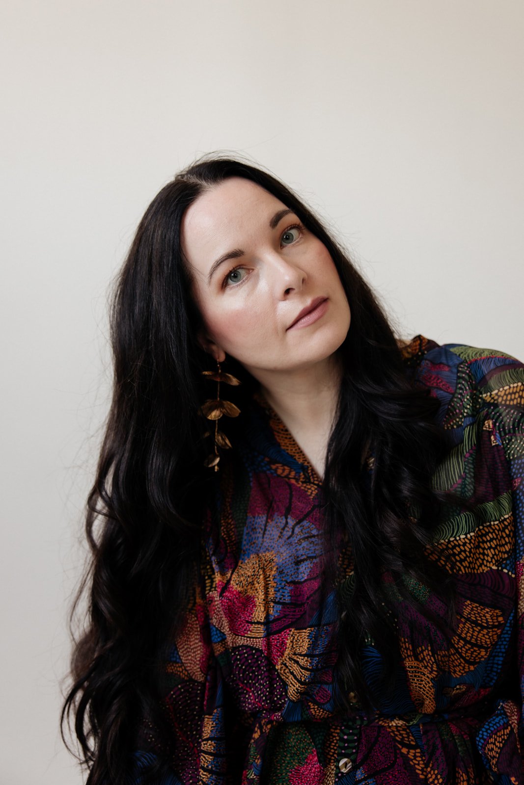 Sara Moon, somatic coach, in reflective state, soft natural tones