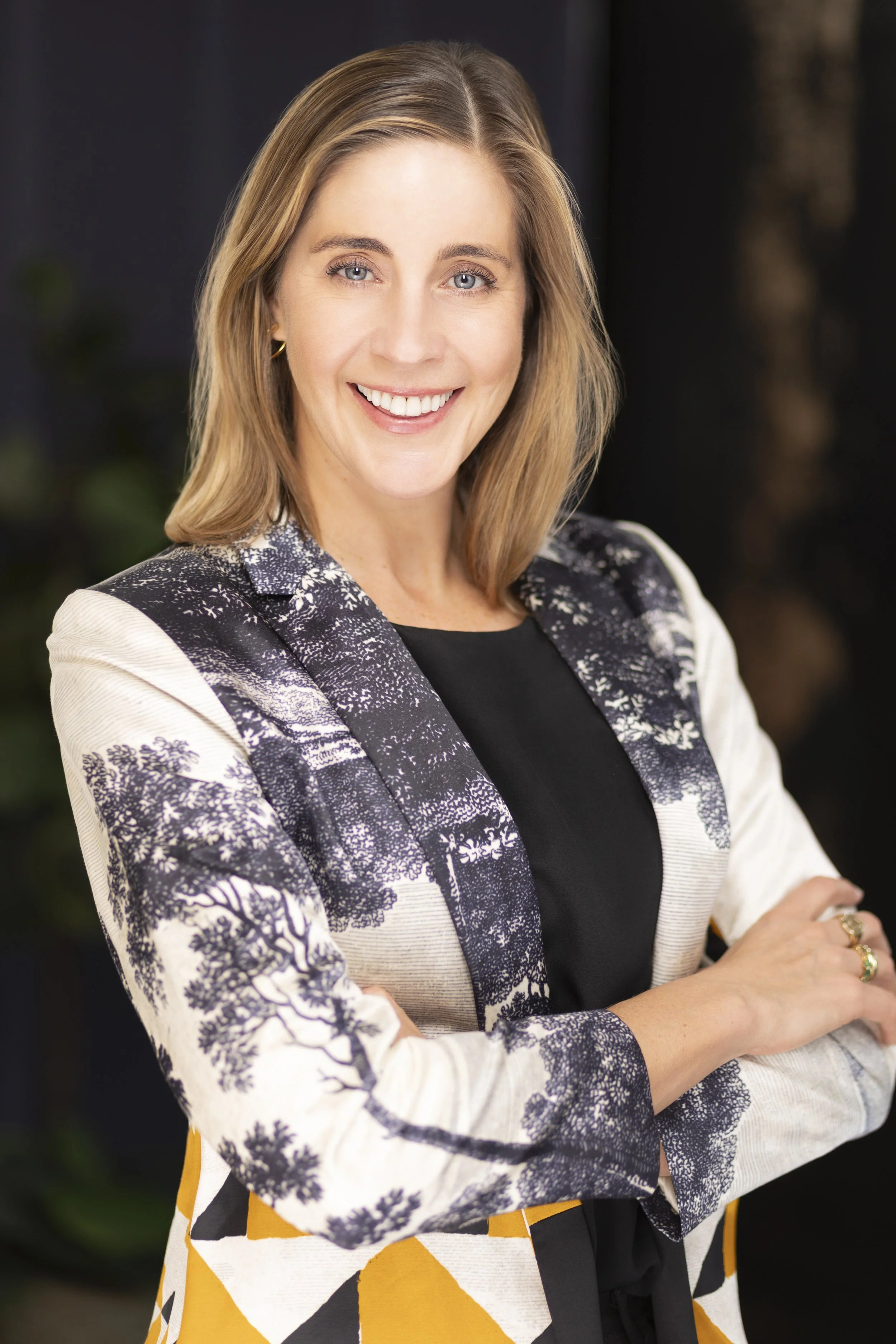Portrait of interior designer Regan Billingsley smiling.
