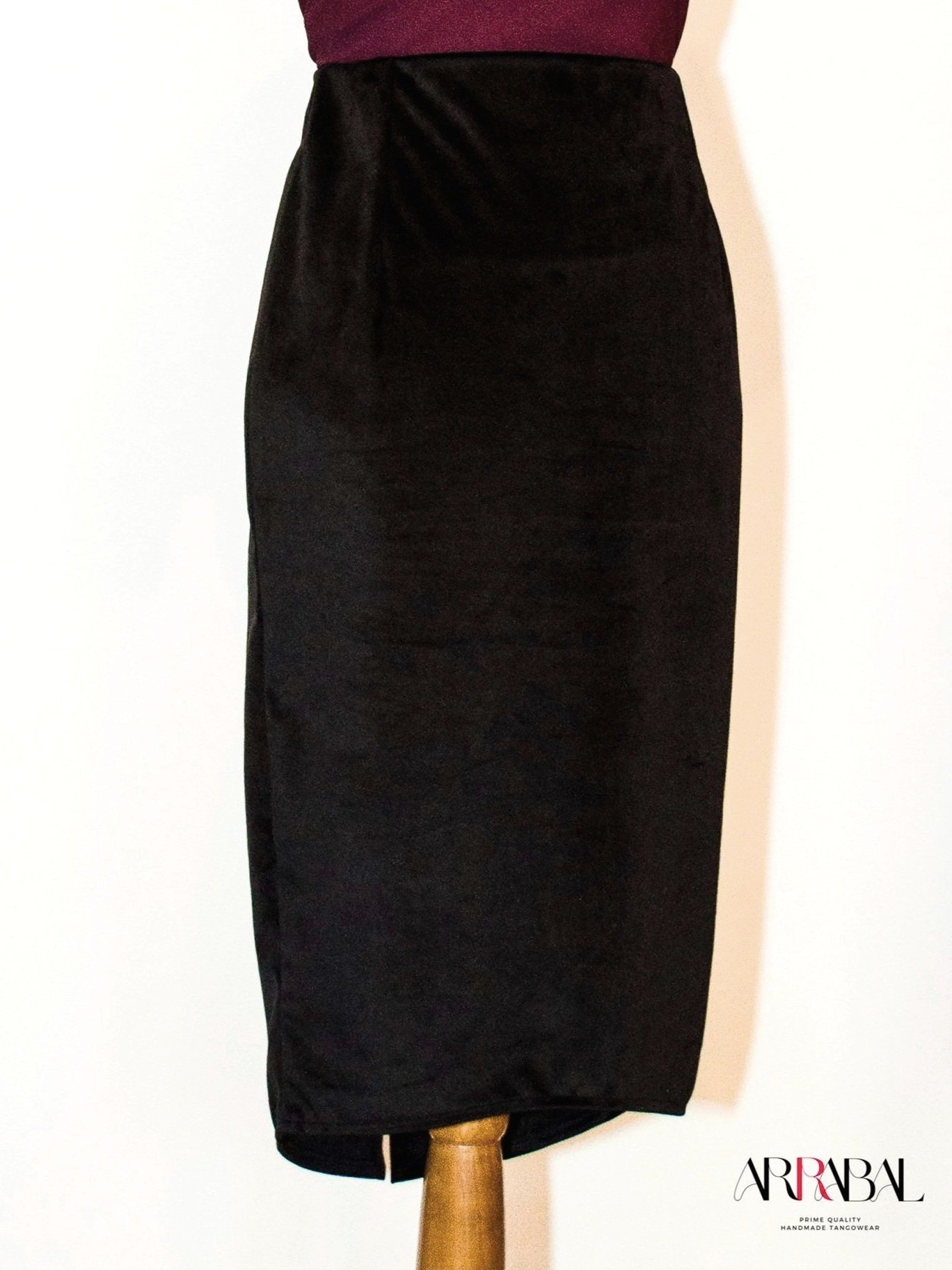 Shop our Black Velvet Tango Skirt, designed with a back slit and stretchable velvet fabric for ultimate comfort and style. Ideal for milongas and tango performances.