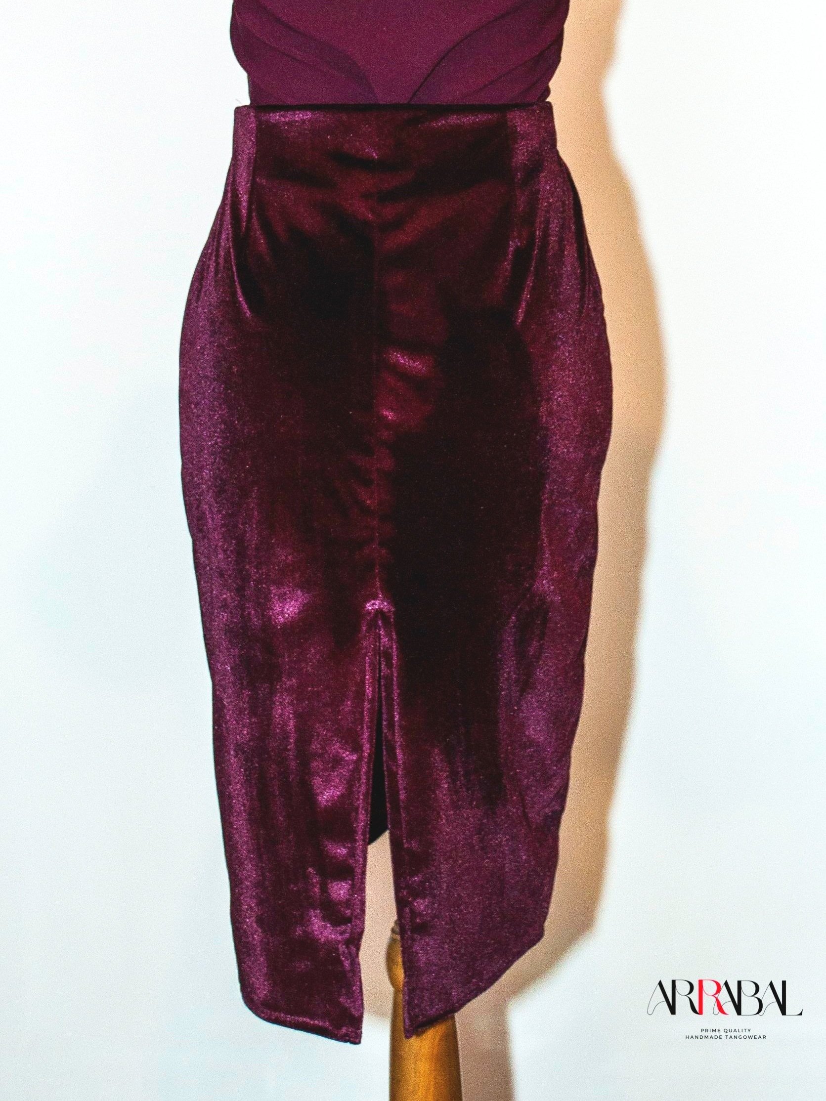 Shop our Burgundy Red Velvet Tango Skirt, designed with a back slit and stretchable velvet fabric for ultimate comfort and style. Ideal for milongas and tango performances.