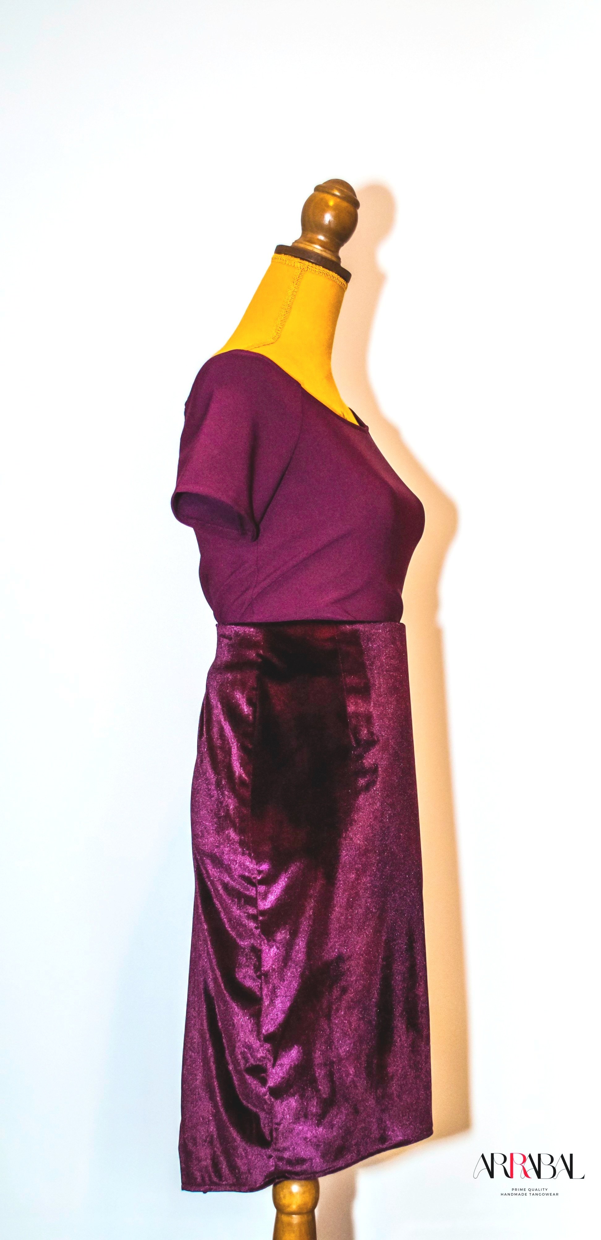 Shop our Burgundy Red Velvet Tango Skirt, designed with a back slit and stretchable velvet fabric for ultimate comfort and style. Ideal for milongas and tango performances.