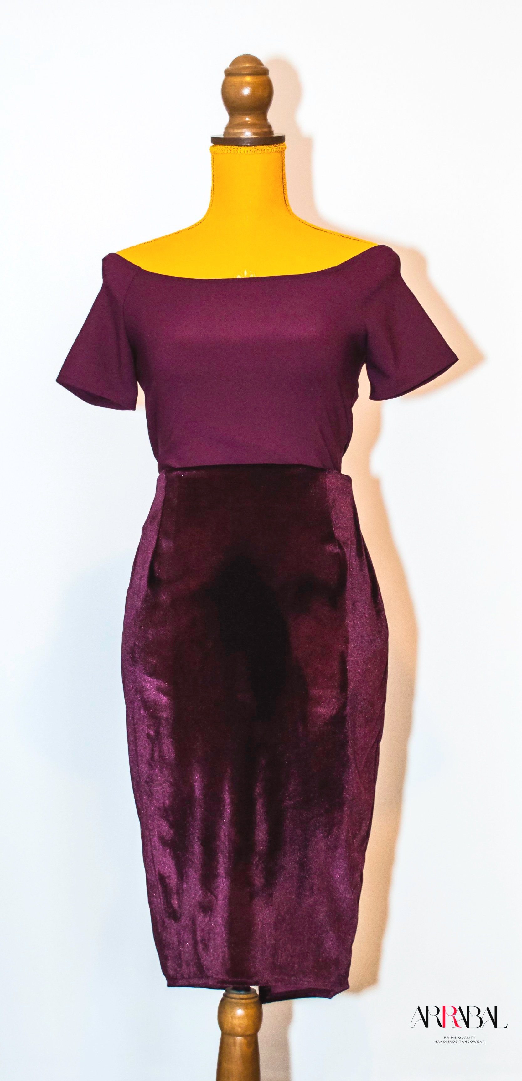 Shop our Burgundy Red Velvet Tango Skirt, designed with a back slit and stretchable velvet fabric for ultimate comfort and style. Ideal for milongas and tango performances.