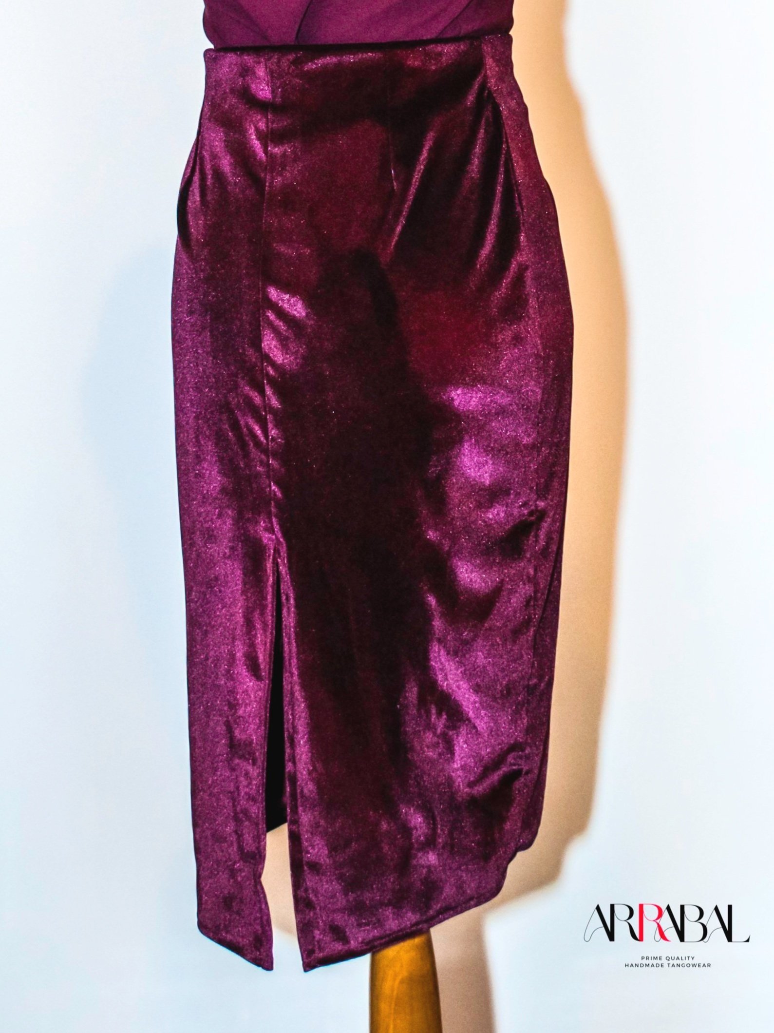 Shop our Burgundy Red Velvet Tango Skirt, designed with a back slit and stretchable velvet fabric for ultimate comfort and style. Ideal for milongas and tango performances.