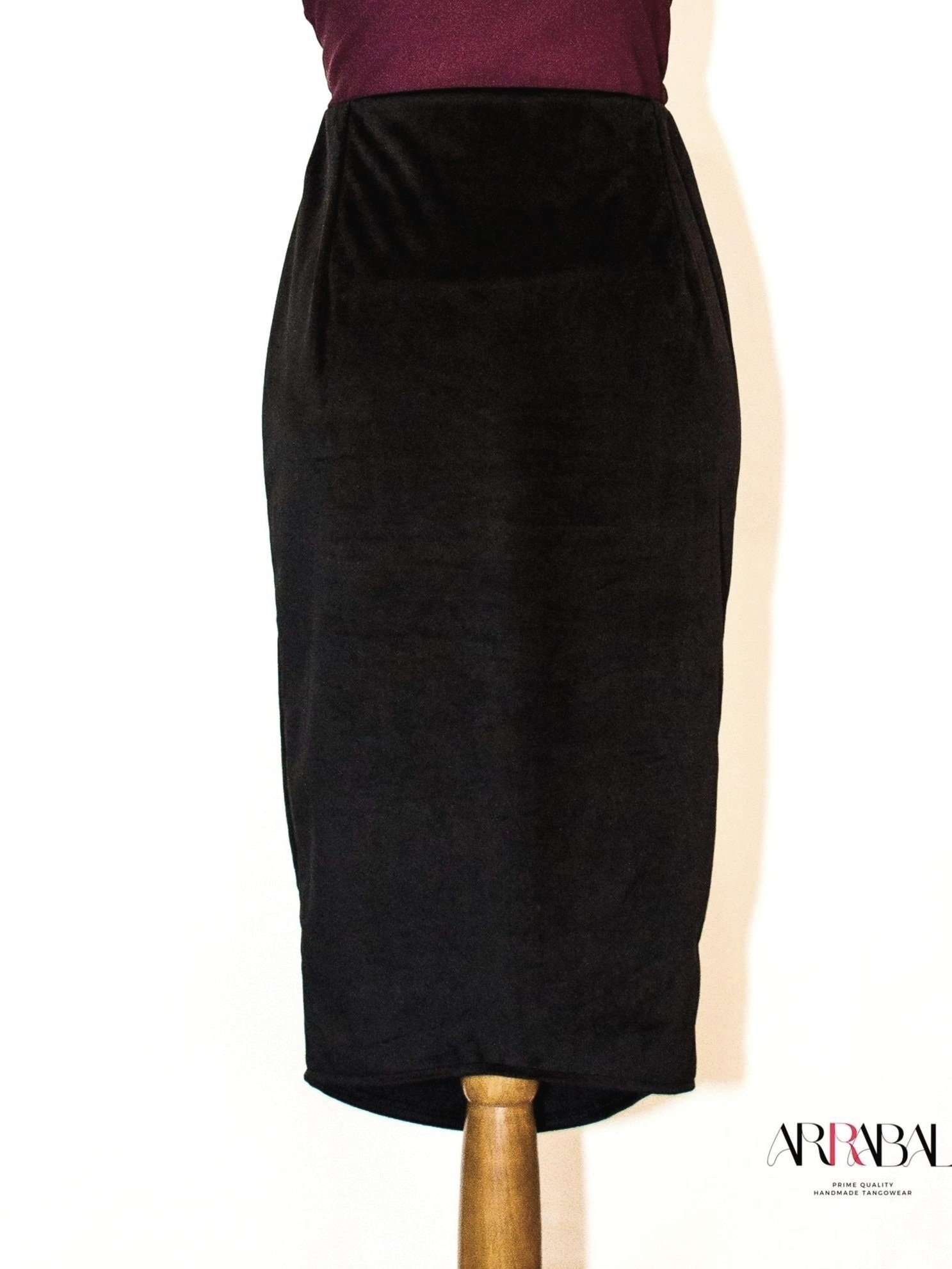 Shop our Black Velvet Tango Skirt, designed with a back slit and stretchable velvet fabric for ultimate comfort and style. Ideal for milongas and tango performances.