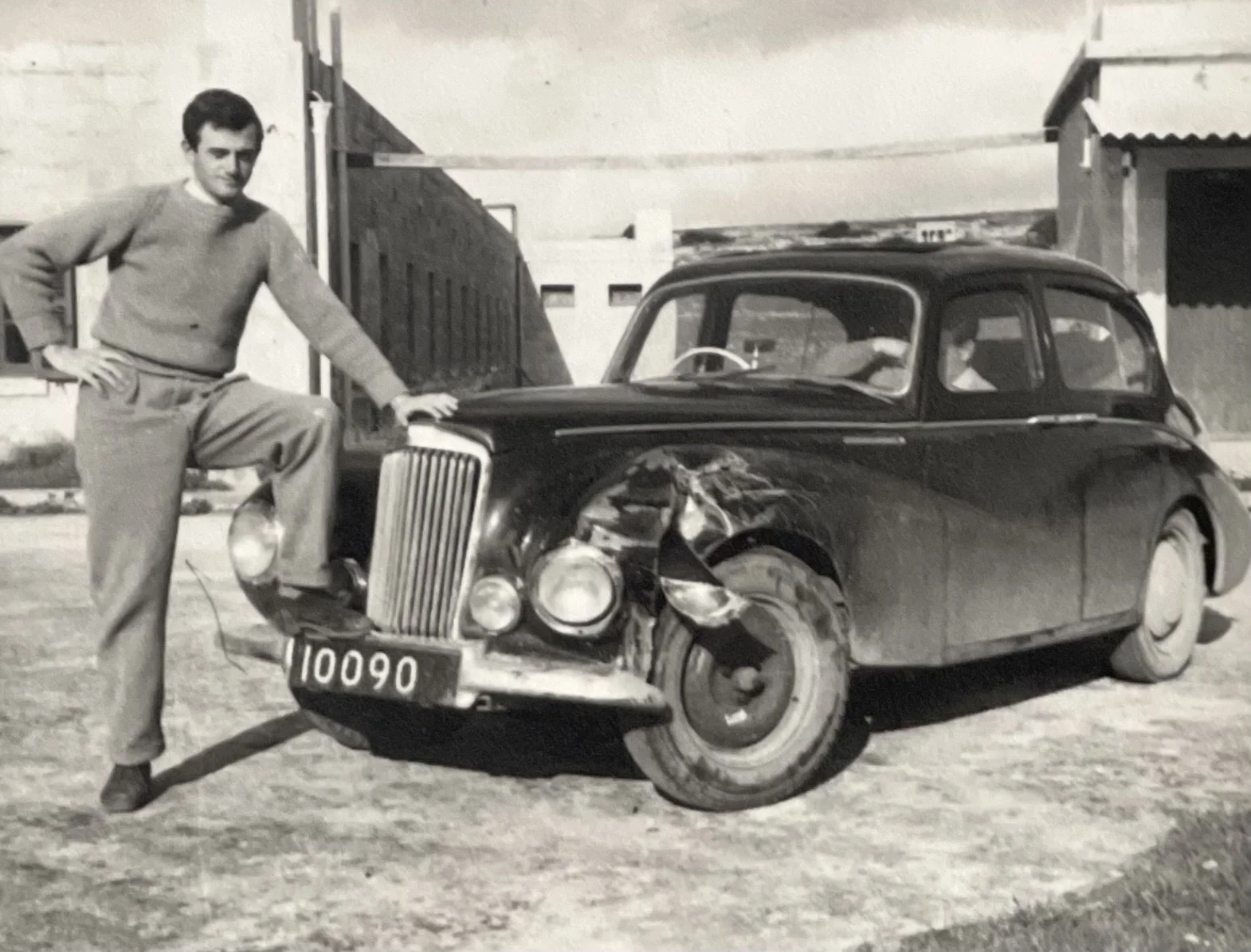 04 - Younger days with his prized car.jpg