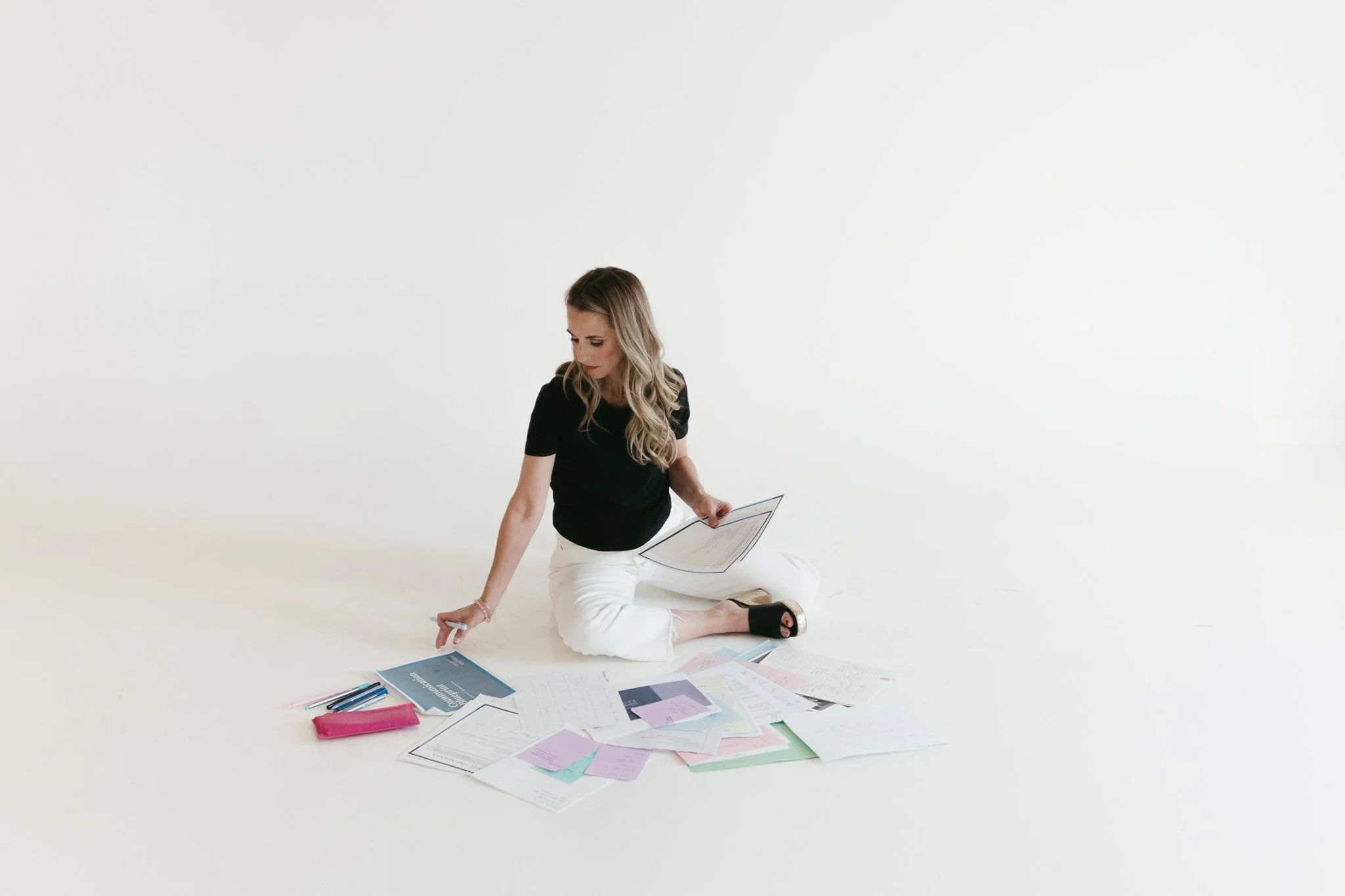 Chief Communications Officer,Stacy of Kate and Steele,looking at blueprint