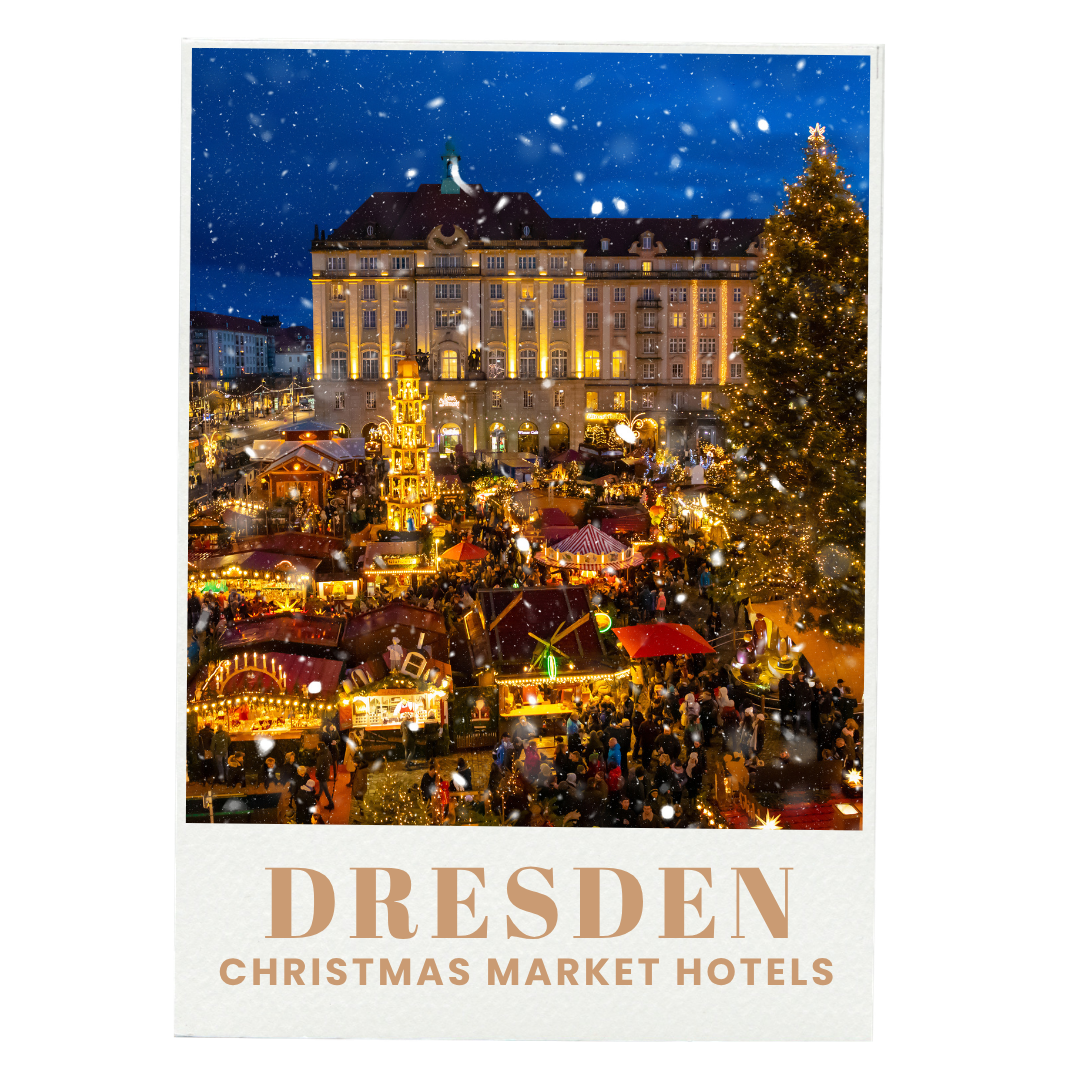 Christmas market in Dresden at night with a large decorated Christmas tree and festive stalls, all illuminated, with snow falling and a historic building in the background.