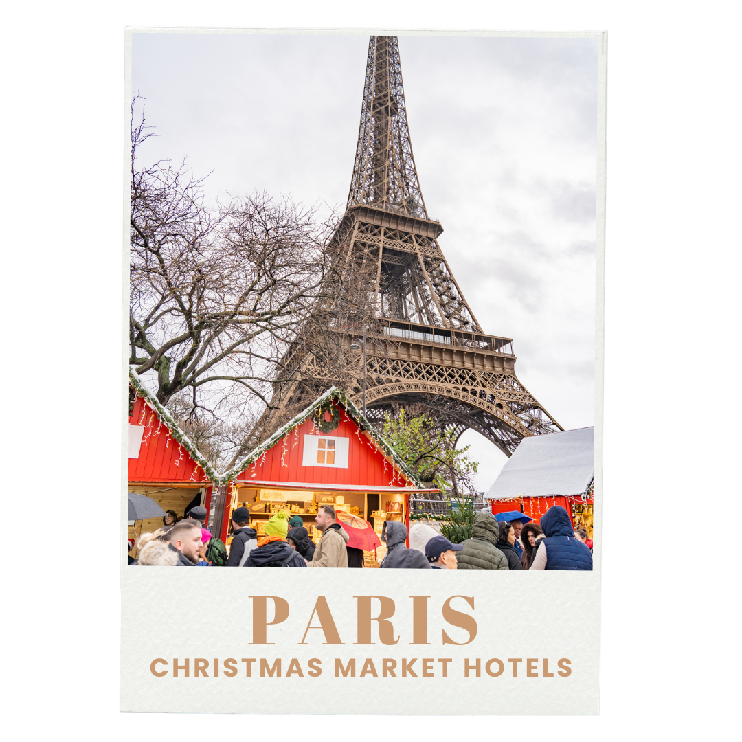 Paris Christmas Market with the Eiffel Tower in the background and people browsing market stalls.