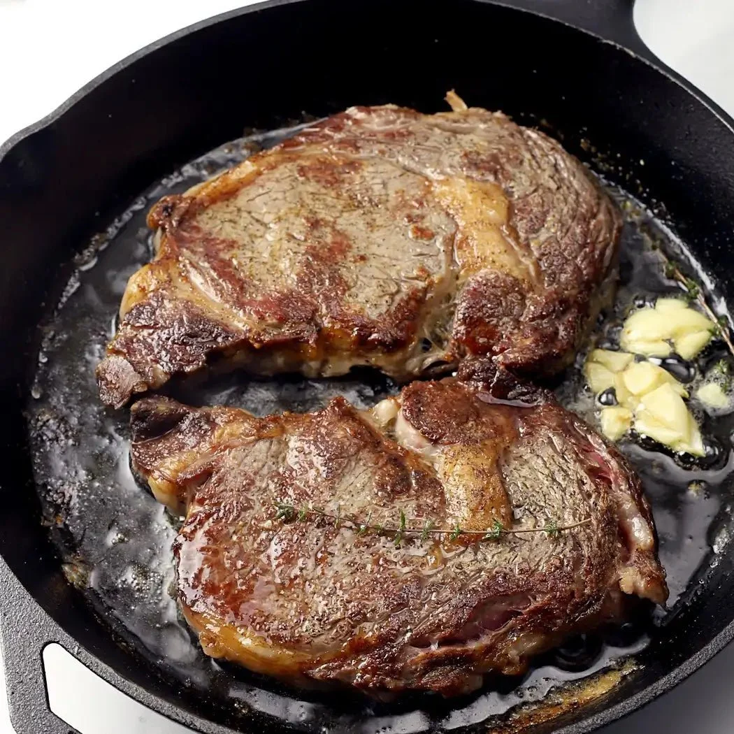Cast Iron Ribeyes with Cowboy Butter &amp; Crispy Potatoes