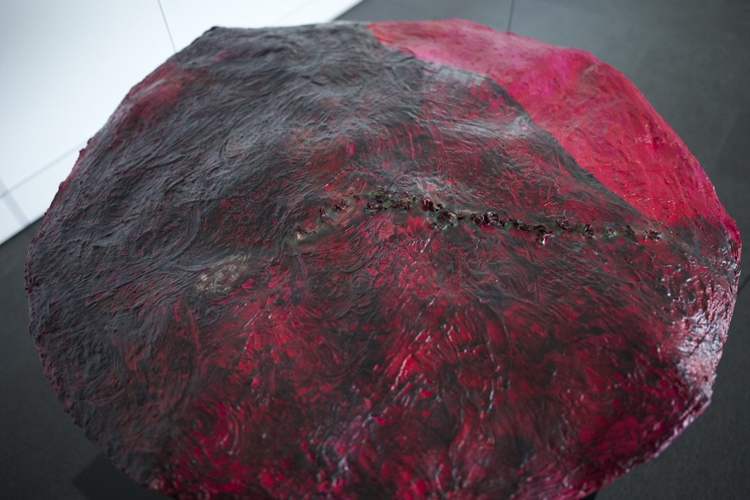 Our Island / Maria’s Island (Amniotic Ocean), 2022
(top, Installation view)
Oil with encaustic on cast paper, dried hibiscus flowers, leather cord
42” dia. X 6”