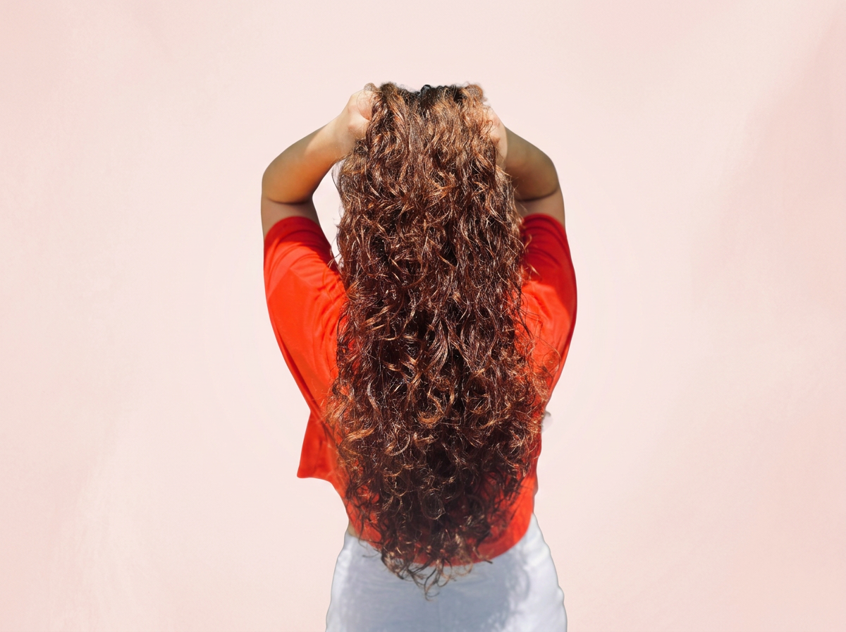 Long curly hair with layers and natural curl pattern