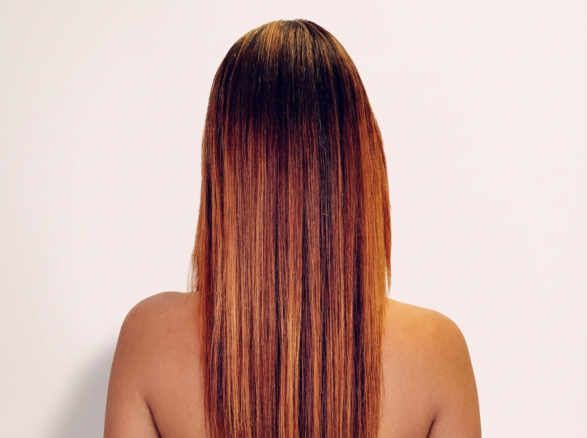 Smooth shiny hair after frizz therapy services