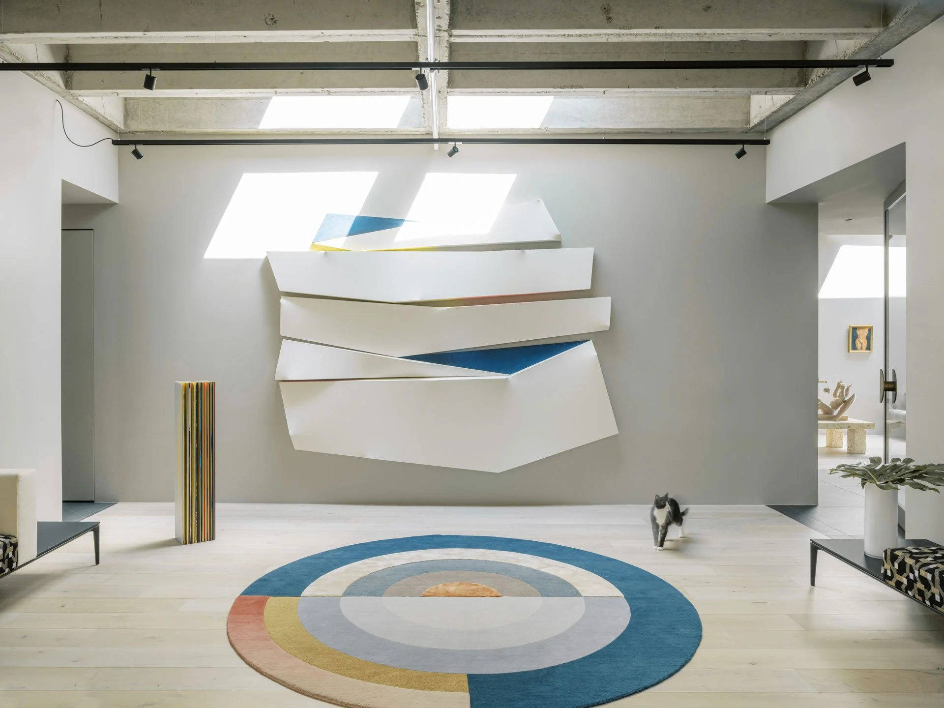 Foyer with commissioned 3D installation art by Eduardo Portillo featuring Hermann the cat