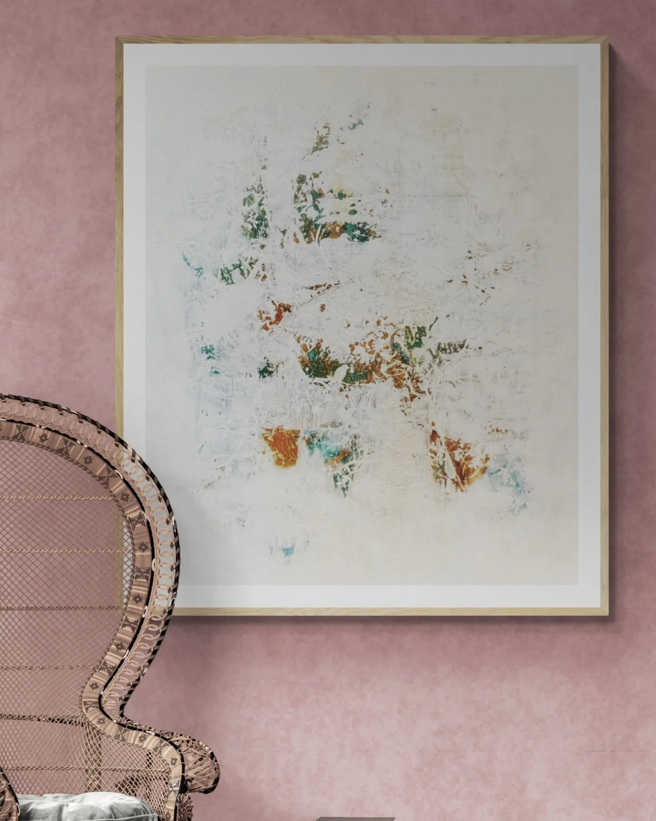 A framed abstract art piece on a pink wall, partially obscured by a pink chair with a patterned back.