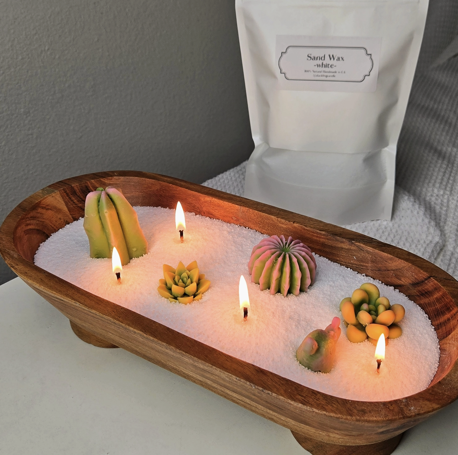Make a candle with sand wax and any vessel from the shop. -$45