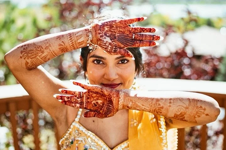 When your love story is literally written on your hands. This bride&rsquo;s mehndi was nothing short of breathtaking, and her glow? Absolutely unmatched. We loved creating glam that let her natural beauty shine while honoring every meaningful detail 