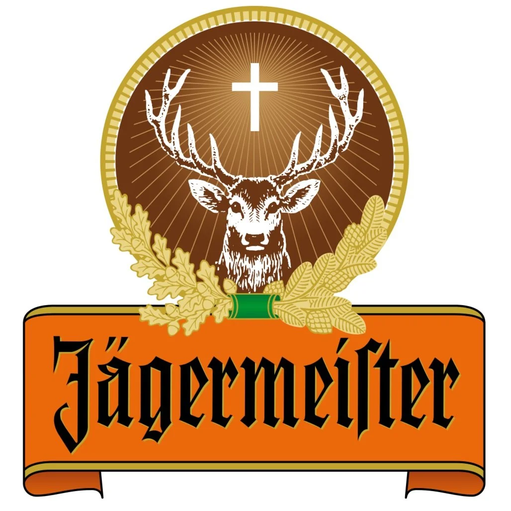 Jägermeister logo featuring a deer with antlers, a cross above its head, surrounded by oak leaves, and the brand name in Gothic script.