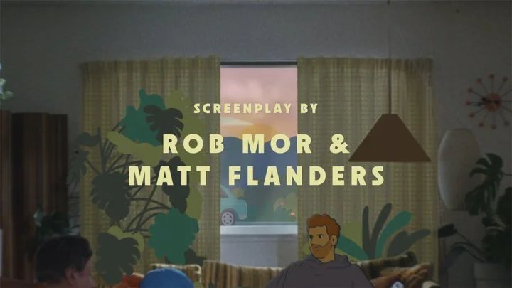 Title screen of an animated film showing the screenplay credits for Rob Mor and Matt Flanders, with a living room interior and a cartoon character sitting on the couch.