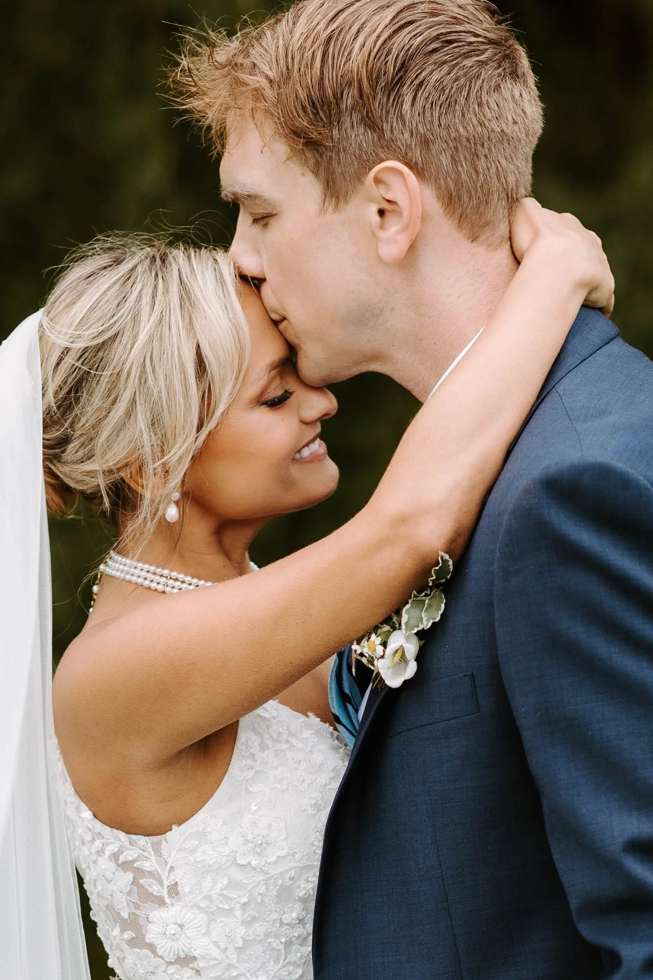 Brett and his wife Jenny sharing a quiet moment on their wedding day