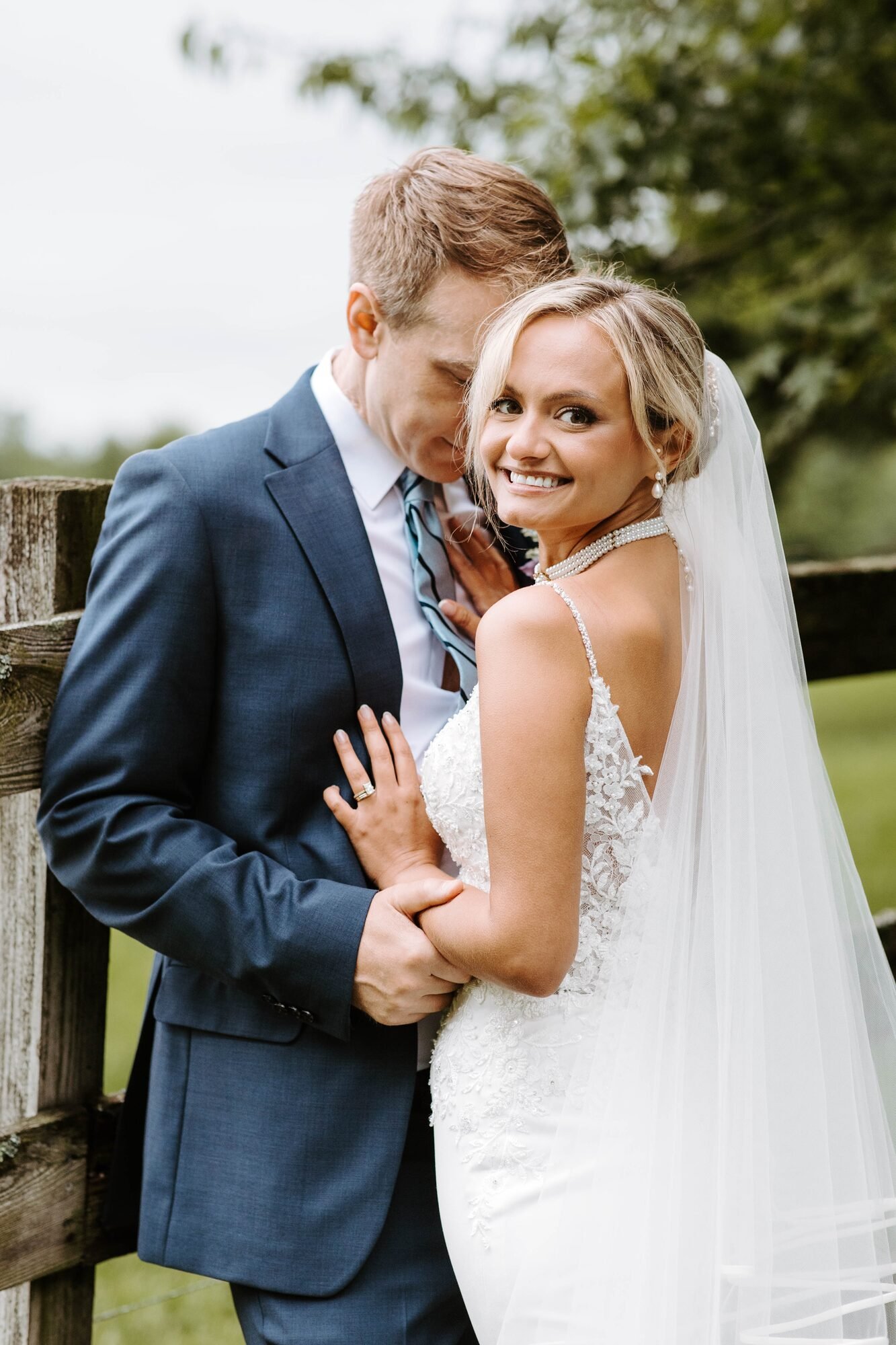 Brett and his wife Jenny smiling together on their wedding day