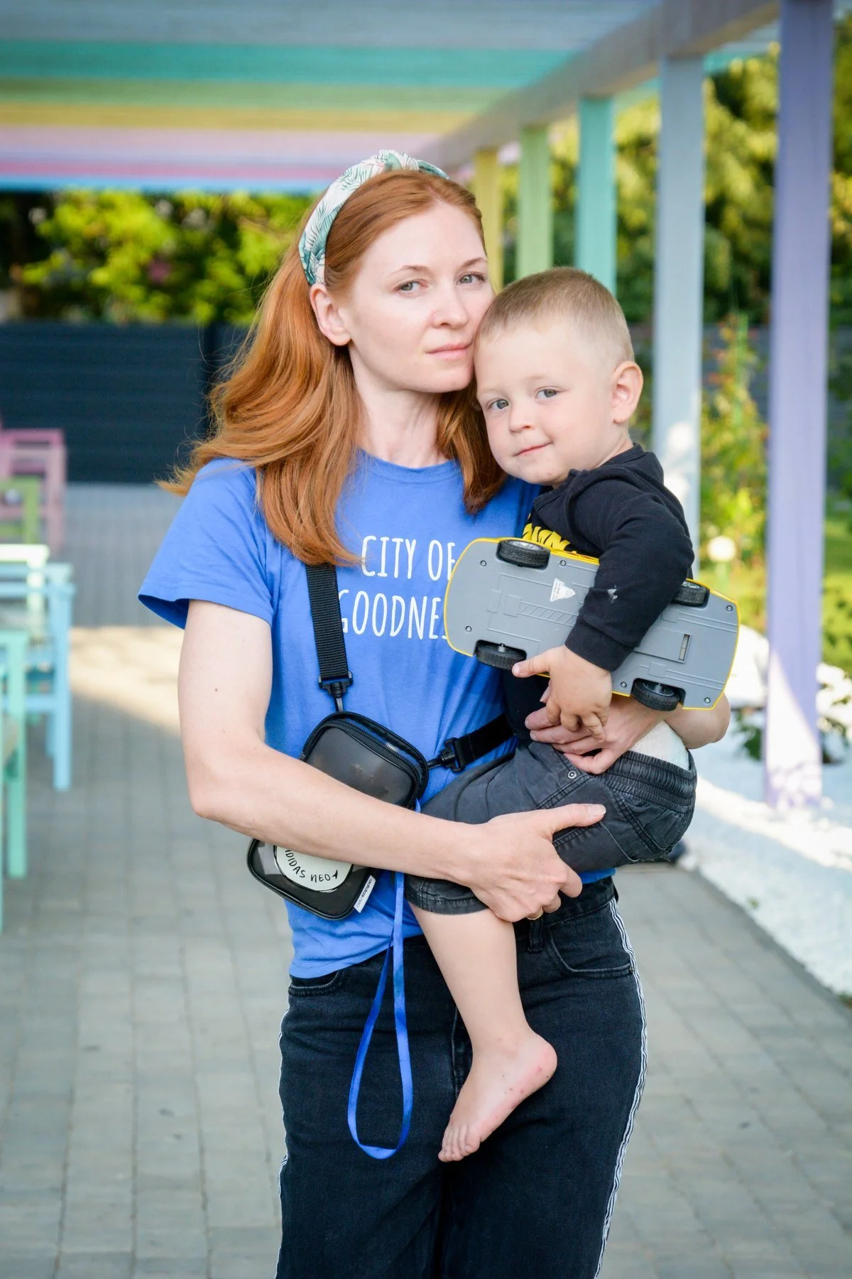 Mother holding her toddler at the City of Goodness shelter