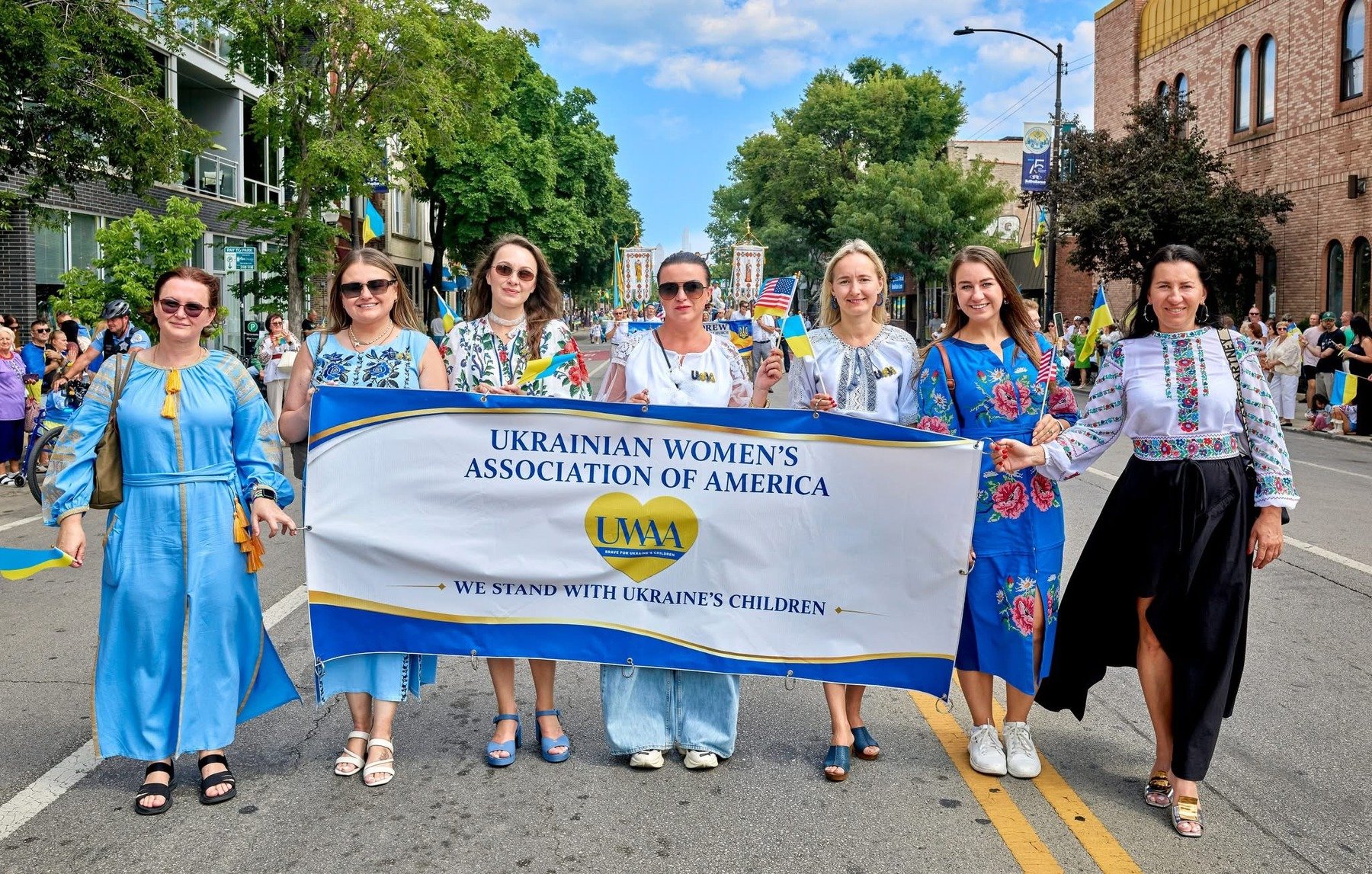 UWAA members marching behind a banner reading Ukrainian Women's Association of America
