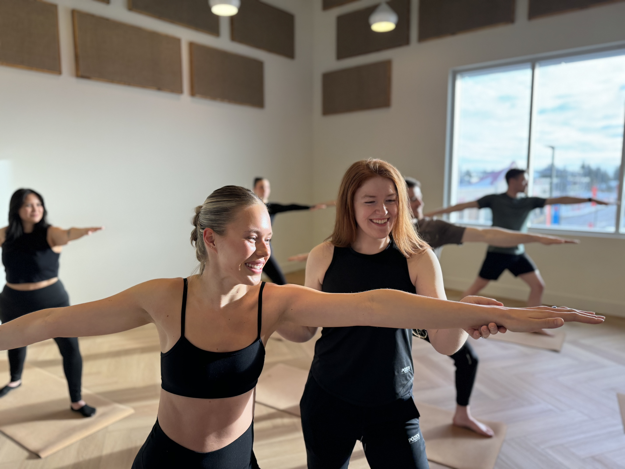 Bright and spacious Sun Studio at PŌZEN Yoga in Calgary, ready for a yoga session