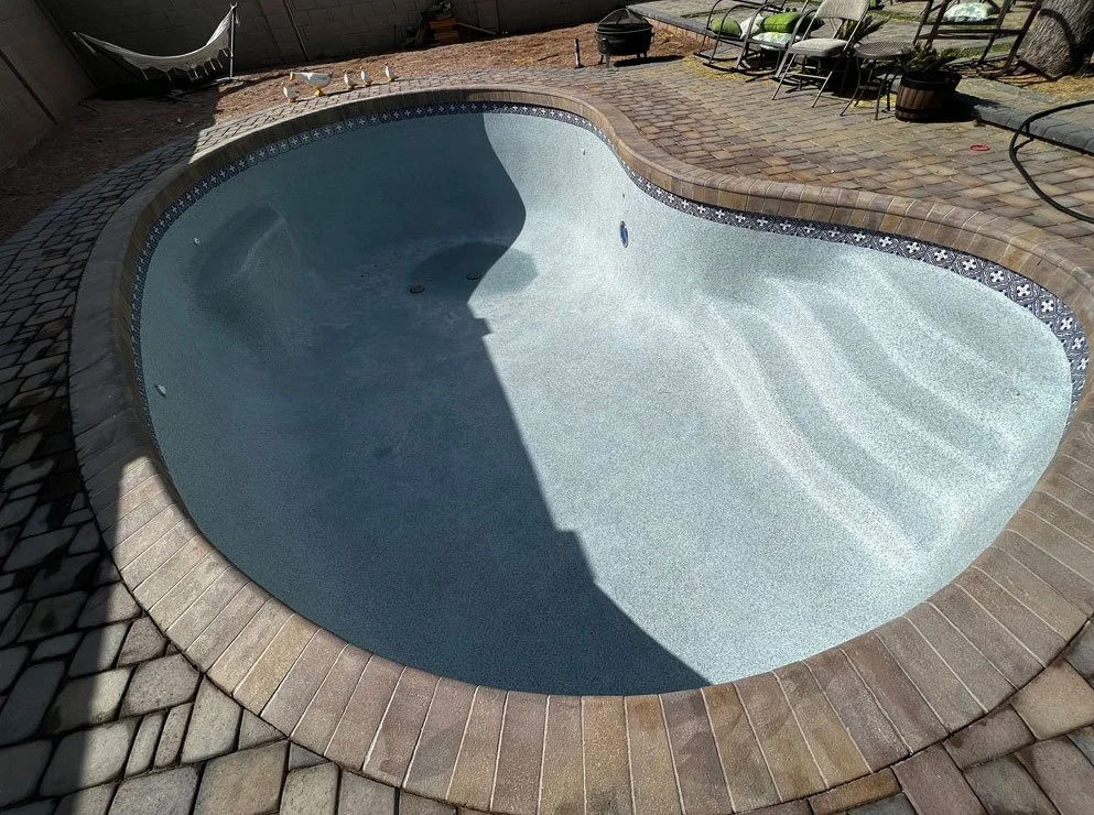 Newly resurfaced swimming pool installation by Foothills Pools in Phoenix, AZ.