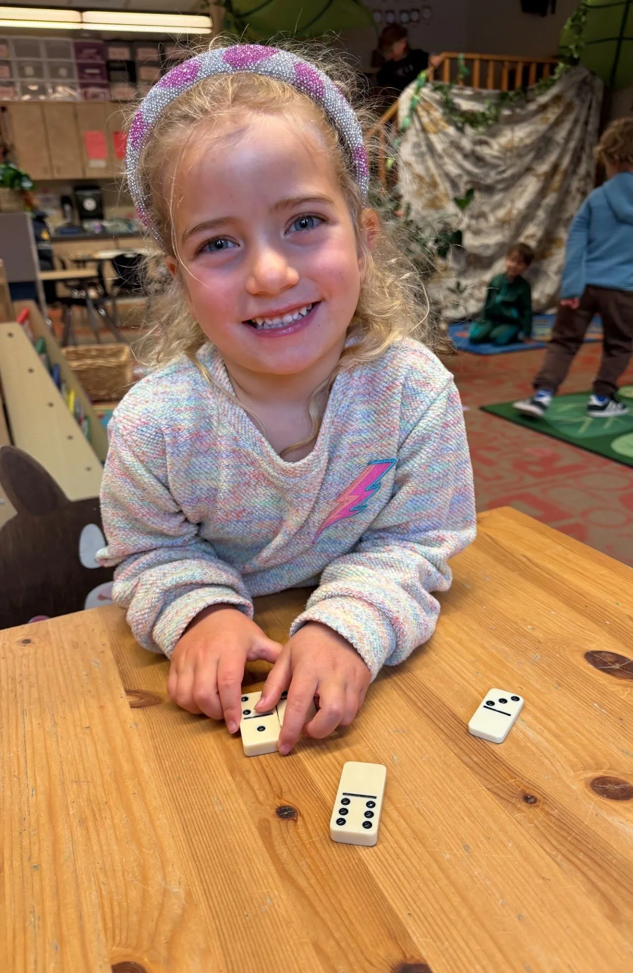 Girl smiling with dominos
