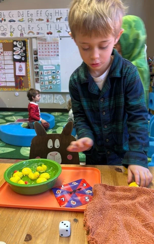 Child throwing pieces to a game
