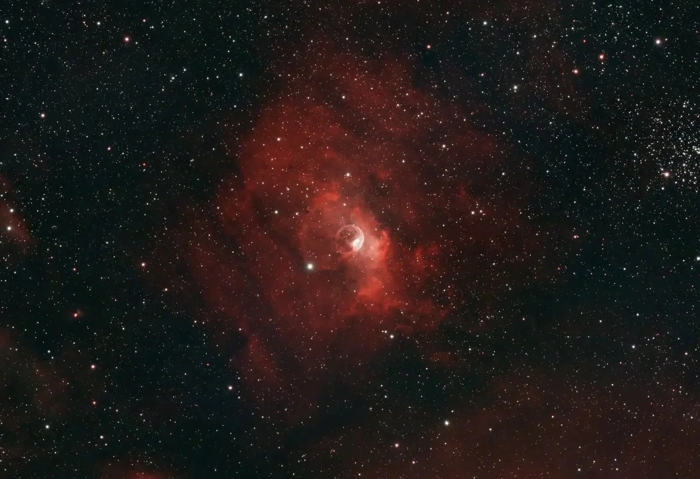 NGC7635 or the Bubble Nebula
Distance: ~9000 ly

The &quot;bubble&quot; is the result of crazy hot gasses leaving the atmosphere of the bright young star inside the bubble. As the hot gas spreads out it makes the surrounding hydrogen glow red. On the