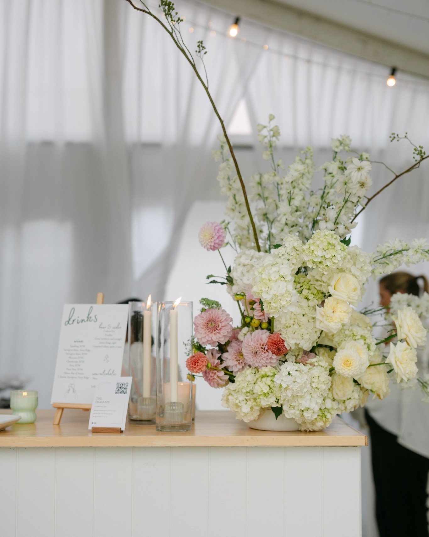 ✨ From &quot;I Do&quot; to Cocktails Too ✨

We love when our florists give ceremony florals a second moment to shine. As you can see here, repurposed floral arrangements steal the spotlight atop the bar in our marquee. Always creating a floral highli