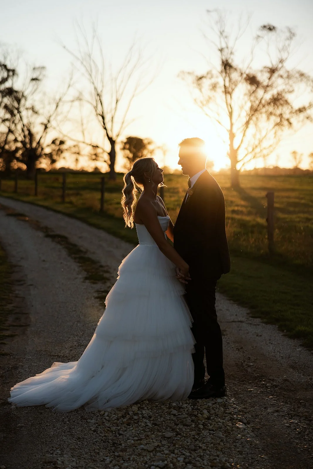 When the light is this good, how do you even choose just one sunset photo? 🌅
Golden skies, happy hearts, a gorgeous couple, and the dreamiest end to a perfect day.

Fiona &amp; Bern you two 🥰
Photographer: @dustandsaltphotography
Dress: @kyhastudio