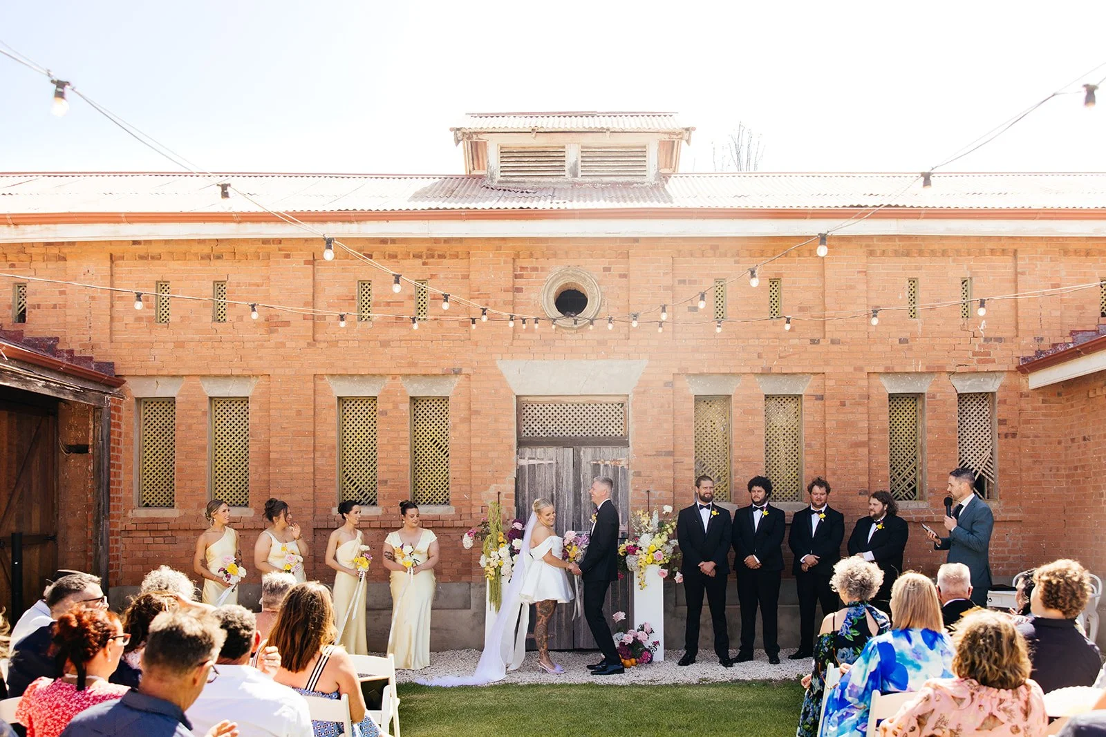 There's a reason our brick STABLES are such a loved ceremony spot.

The history, the weathered character and that unmistakable iconic door it just *works*.

For Billee &amp; Sam, it was the perfect setting for a relaxed summer ceremony: colourful &am