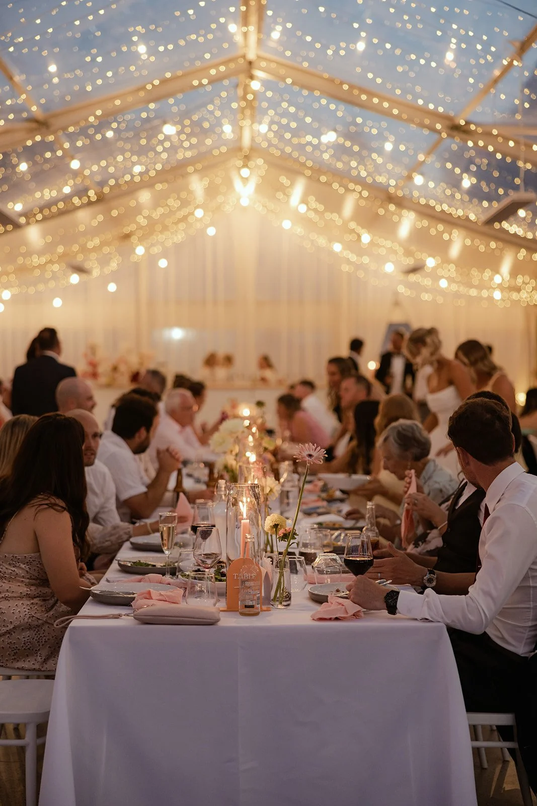 The 1000s of fairy lights are just so damn pretty! And they certainly add to the atmosphere.

Still, we always suggest adding some candles to create a balance to the sparkle from above. So many weddings &amp; events later, and yet we still love love 