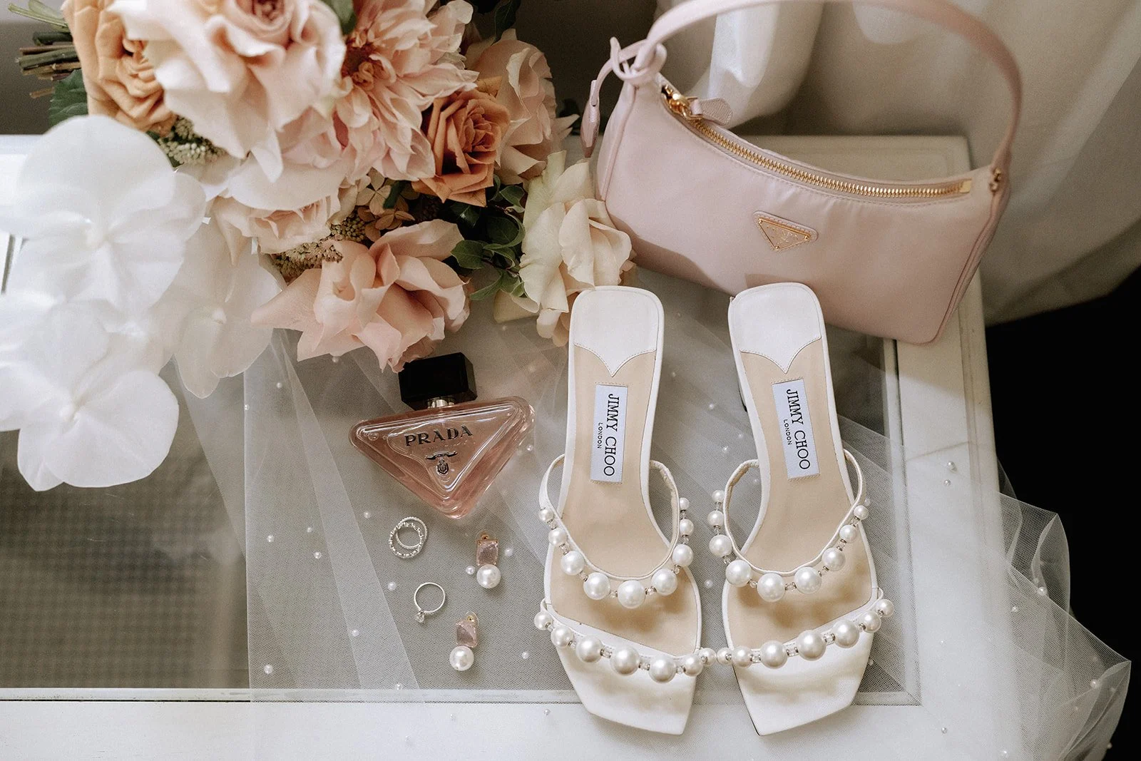 Prada, Gucci &amp; Jimmy Choo 🤍

When your wedding day is the time to treat yourself to those special keepsakes. 
A touch of modern heirloom,  Beth had chosen elegant heels, a treasured handbag, and her signature perfume to mark the moment.

Photo b