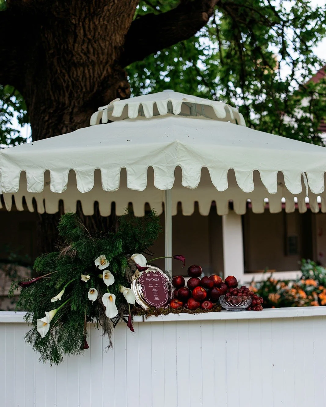 Sophisticated details, beautifully considered. 🤍

It was the little touches that made this celebration distinctly theirs &mdash; a sculptural ring of deep burgundy lilies in place of a traditional bouquet, cocktails and canap&eacute;s served on silv